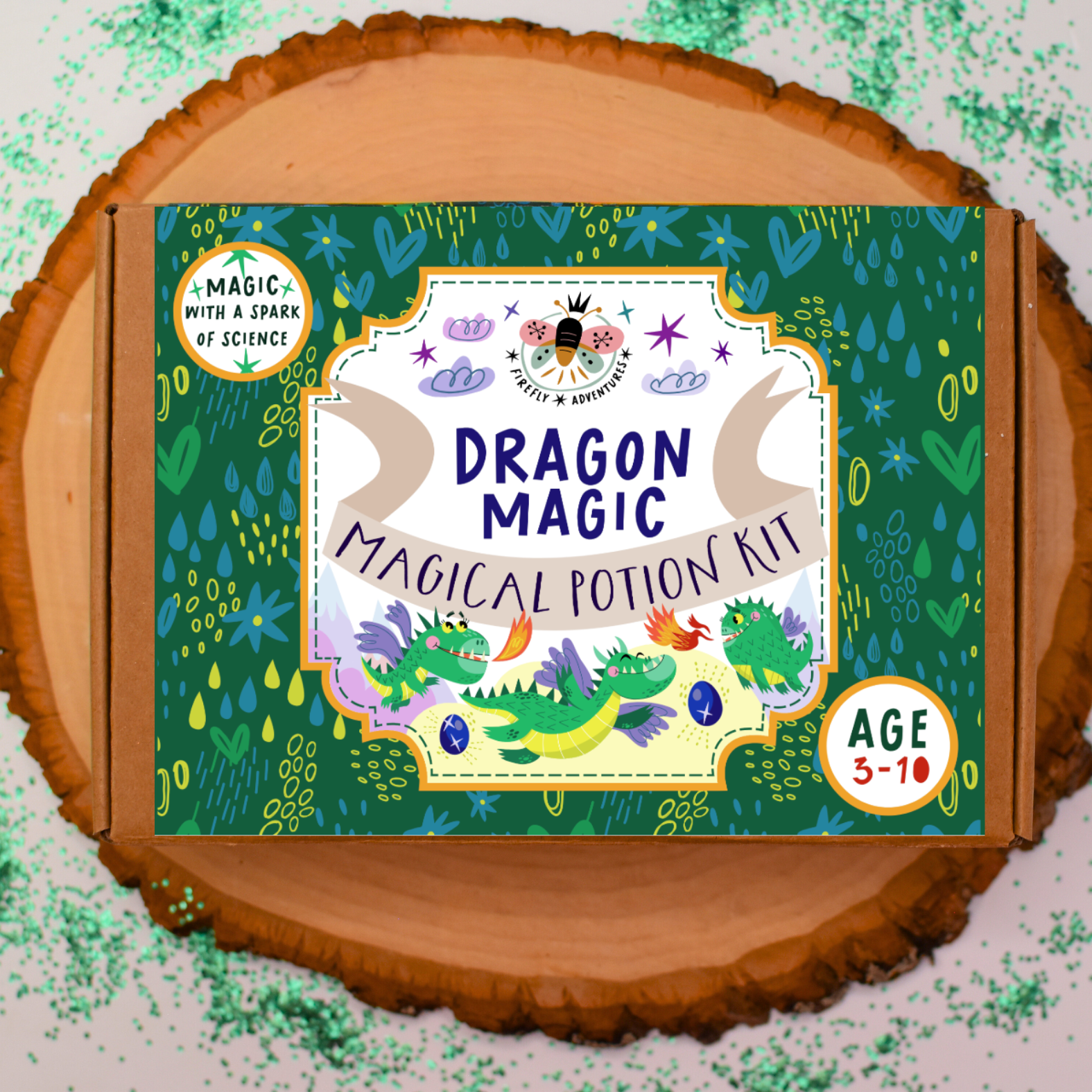 Dragon Magic Magical Potion Kit packaging on a wooden surface with green sprinkles.