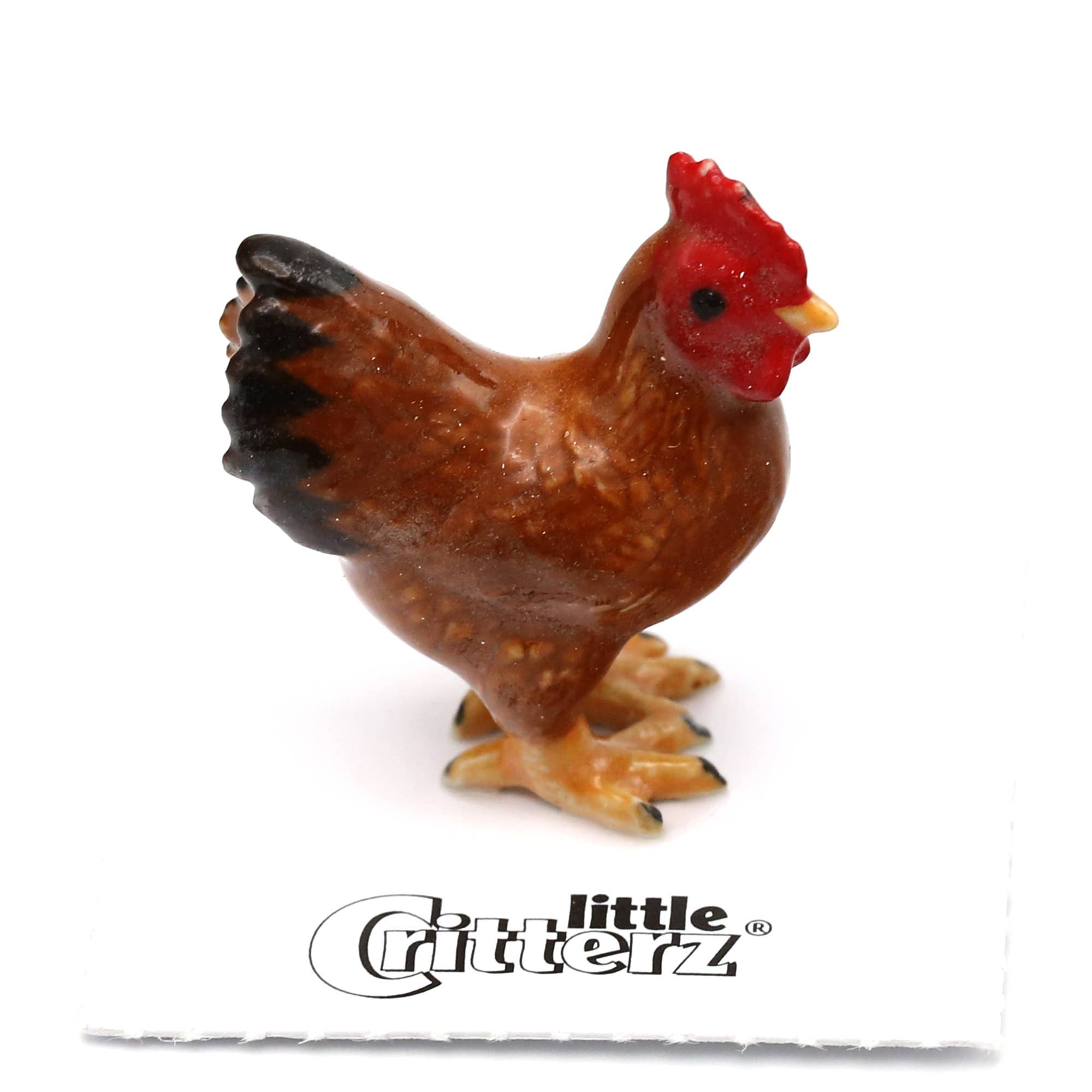 Small figurine of a rooster with 'little Critterz' branding on a white background