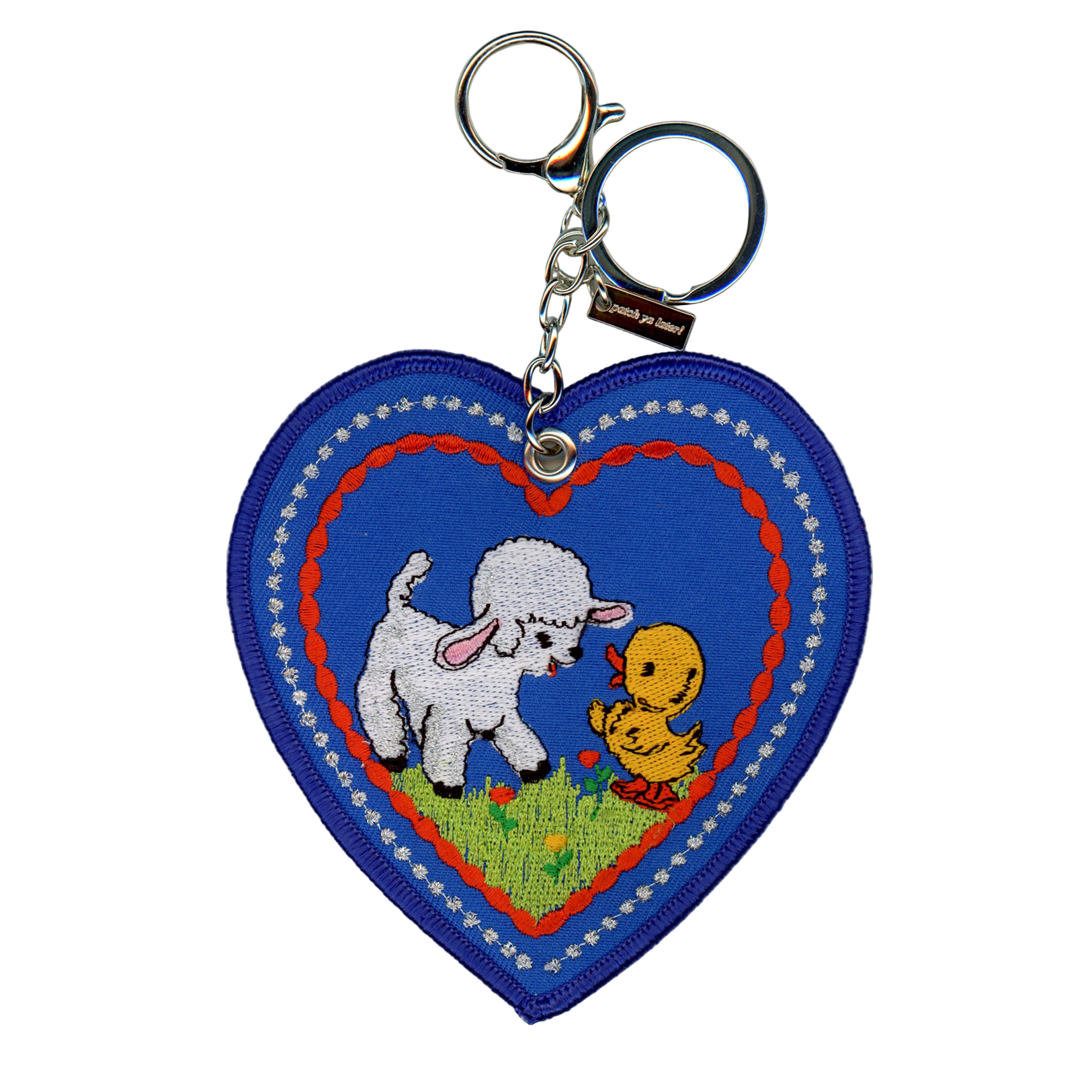 Heart-shaped keychain with a design of a sheep and duckling on a white background
