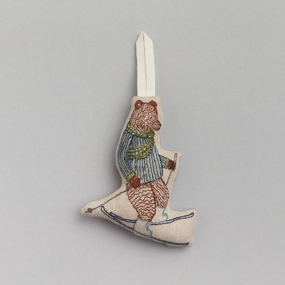 Decorative ornament with a bear design on a gray background