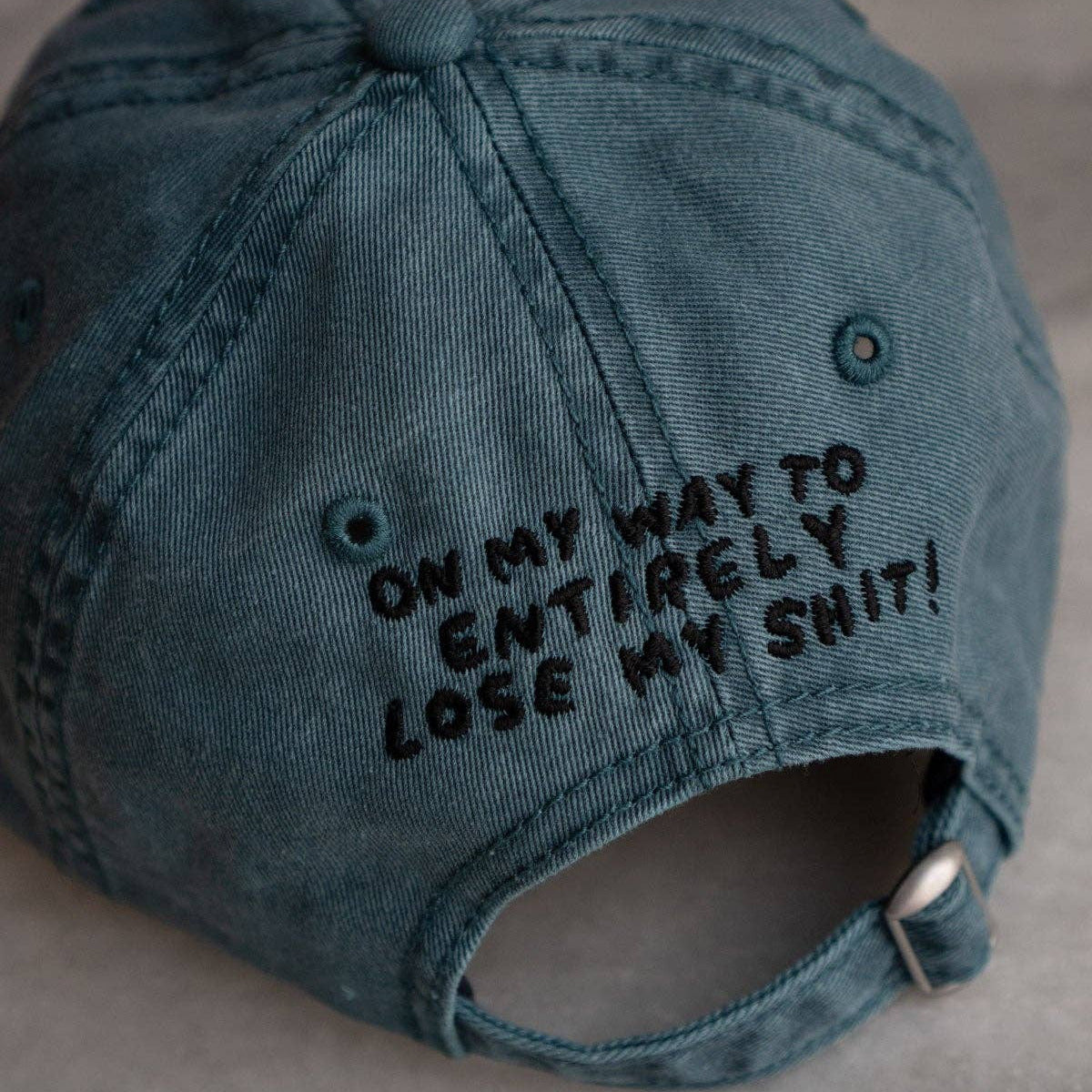 Blue cap with text on a gray background