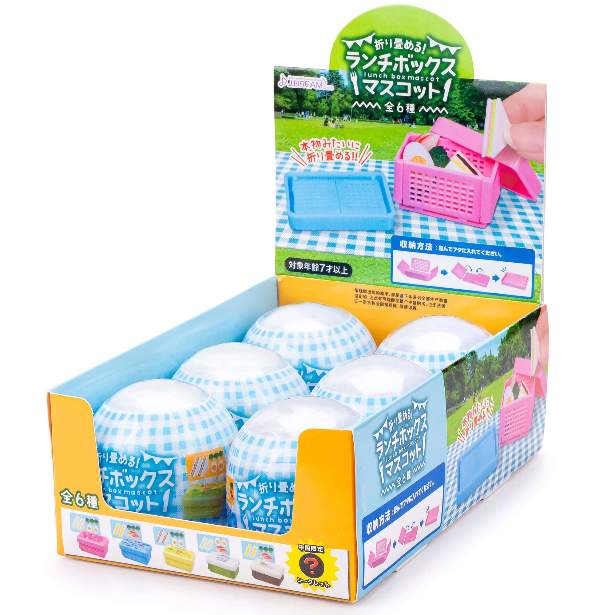 Display box of lunch box toys with colorful packaging and Japanese text.