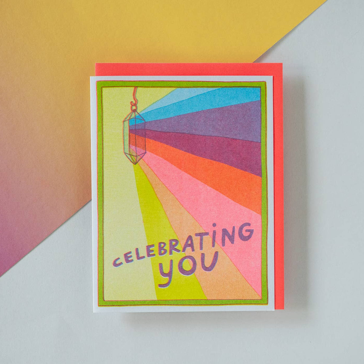 Colorful card with 'Celebrating You' text on a multicolored background