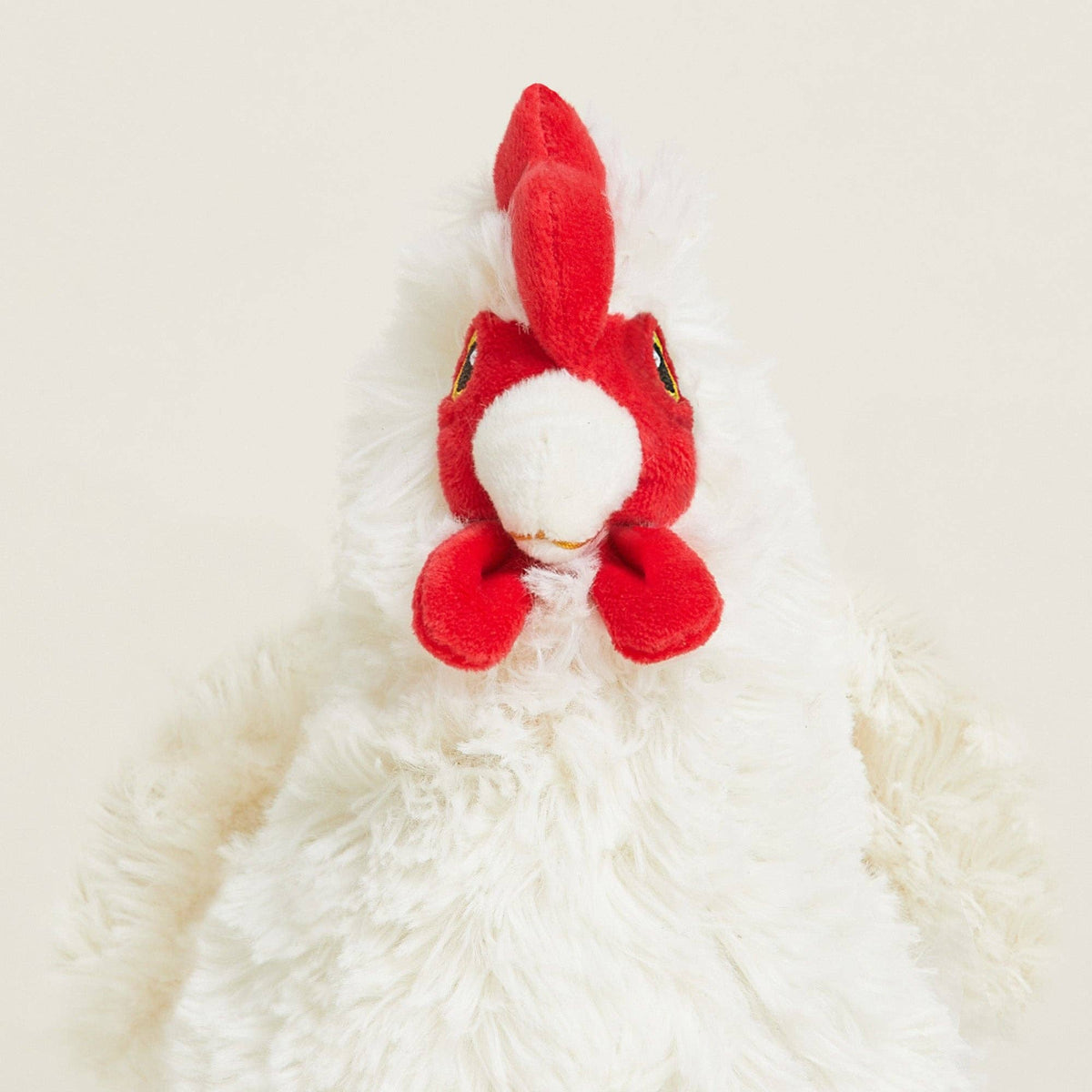 Red plush rabbit toy on a white background