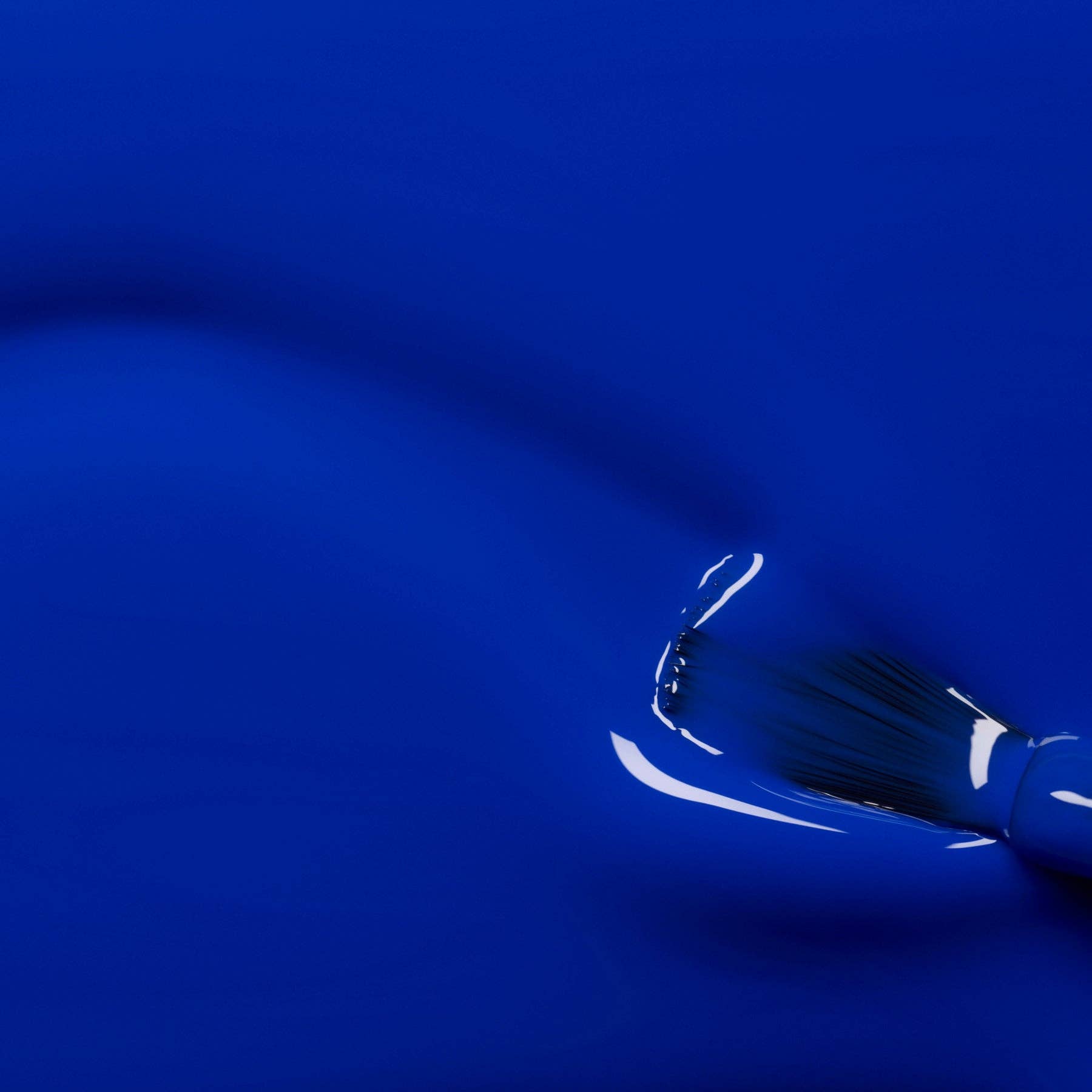 Close-up of a blue fabric with a glossy finish