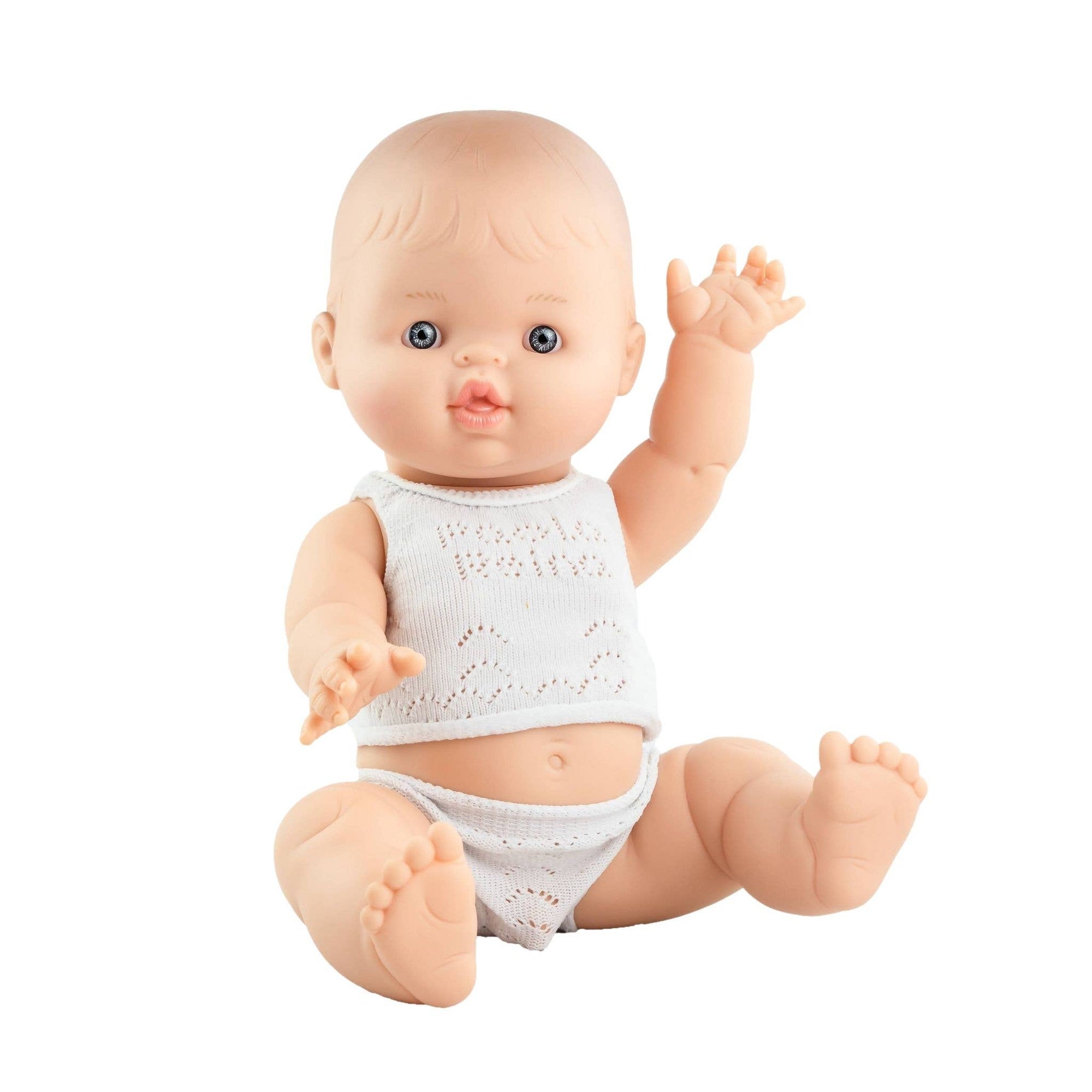 Baby doll with a white outfit on a white background