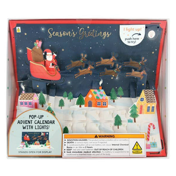 Pop-up advent calendar with lights featuring Santa and reindeer on a snowy night scene.