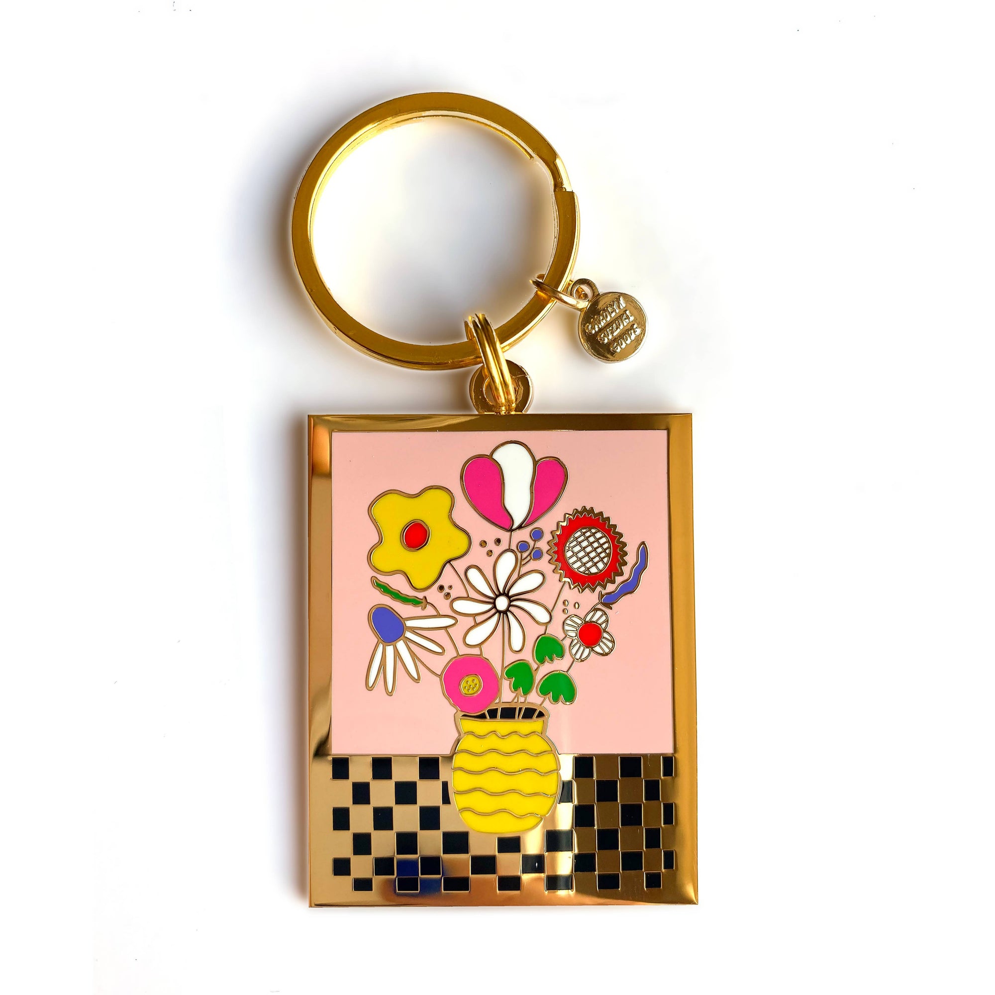Keychain with floral design and gold frame on a white background