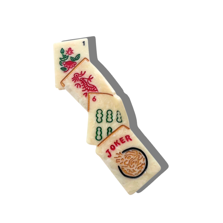 Wooden joker tile from a game on a white background