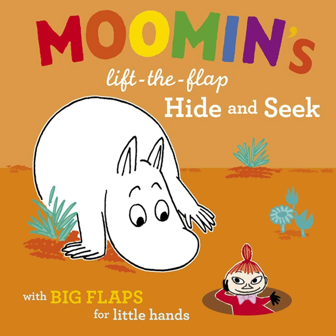 Book cover of 'Moomin's Hide and Seek' with a Moomin character peeking from behind a bush.