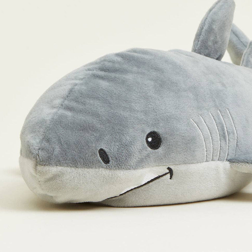 Plush shark toy on a light background