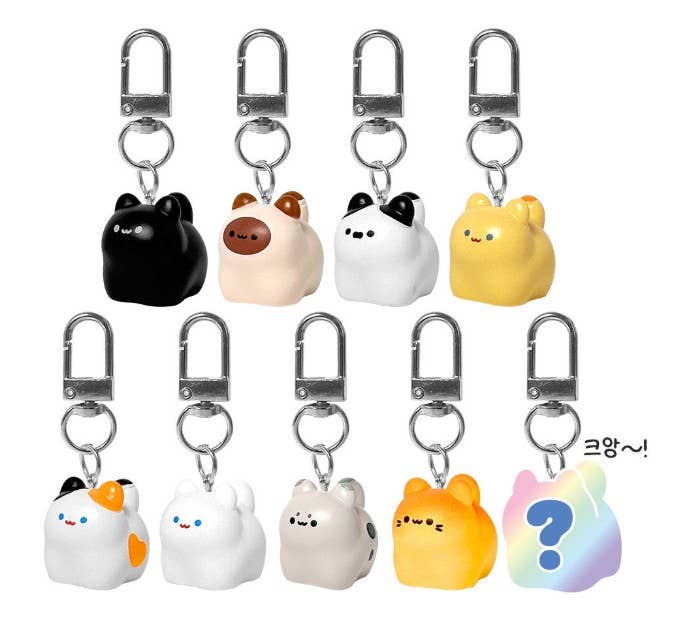 Set of cute animal-shaped keychains with various designs on a white background