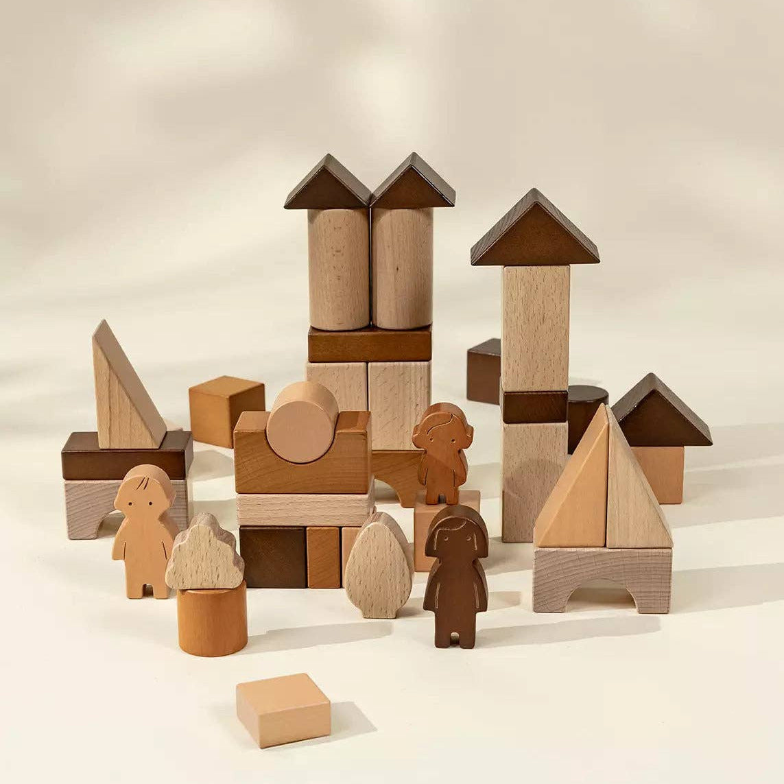 Set of wooden building blocks on a beige background