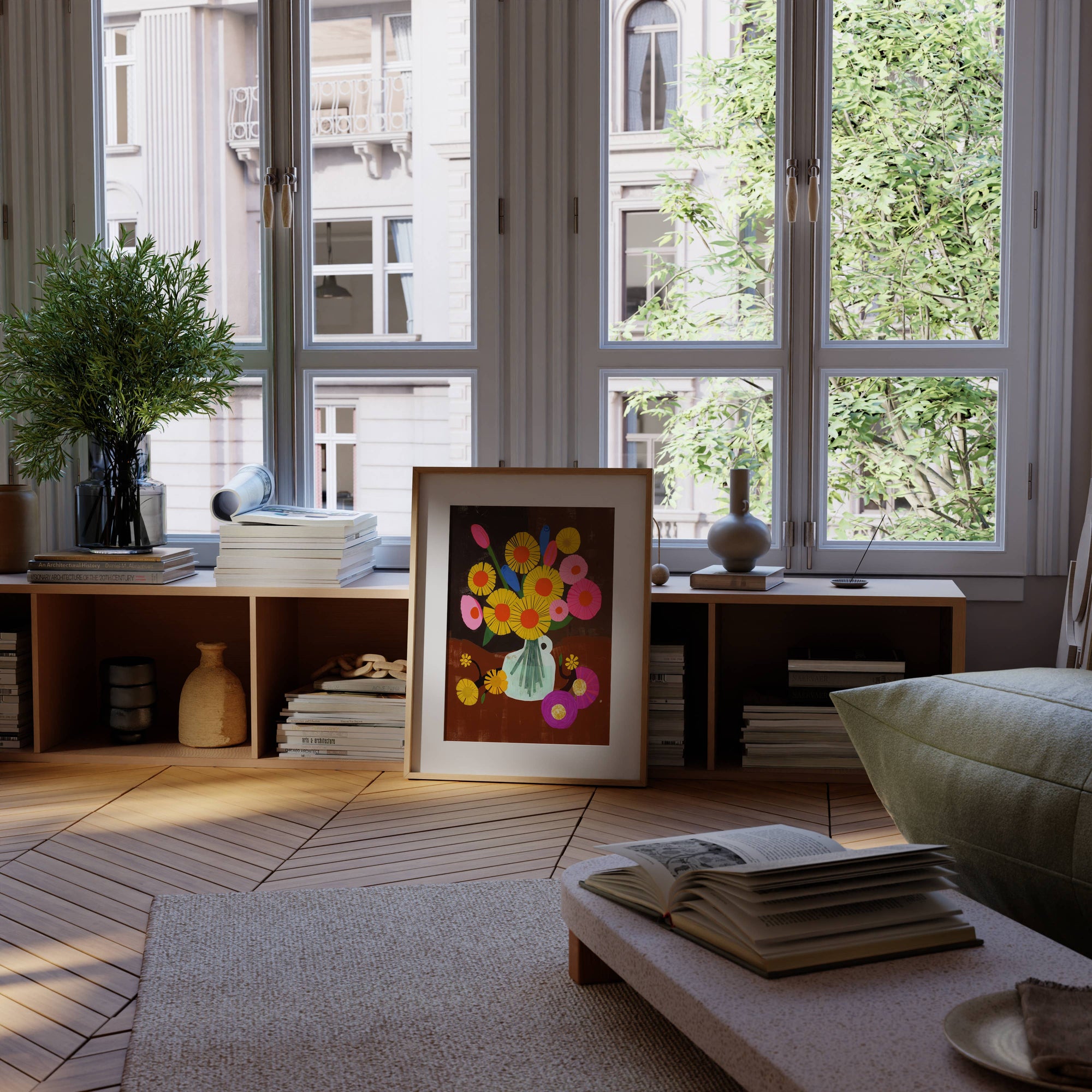 Living room with a painting of flowers on a table, books, and a vase.