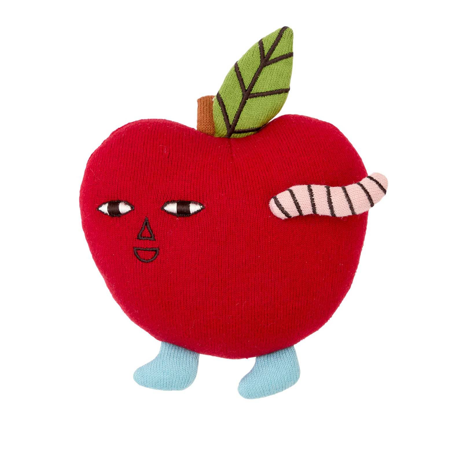 Toy apple with face and worm on a white background