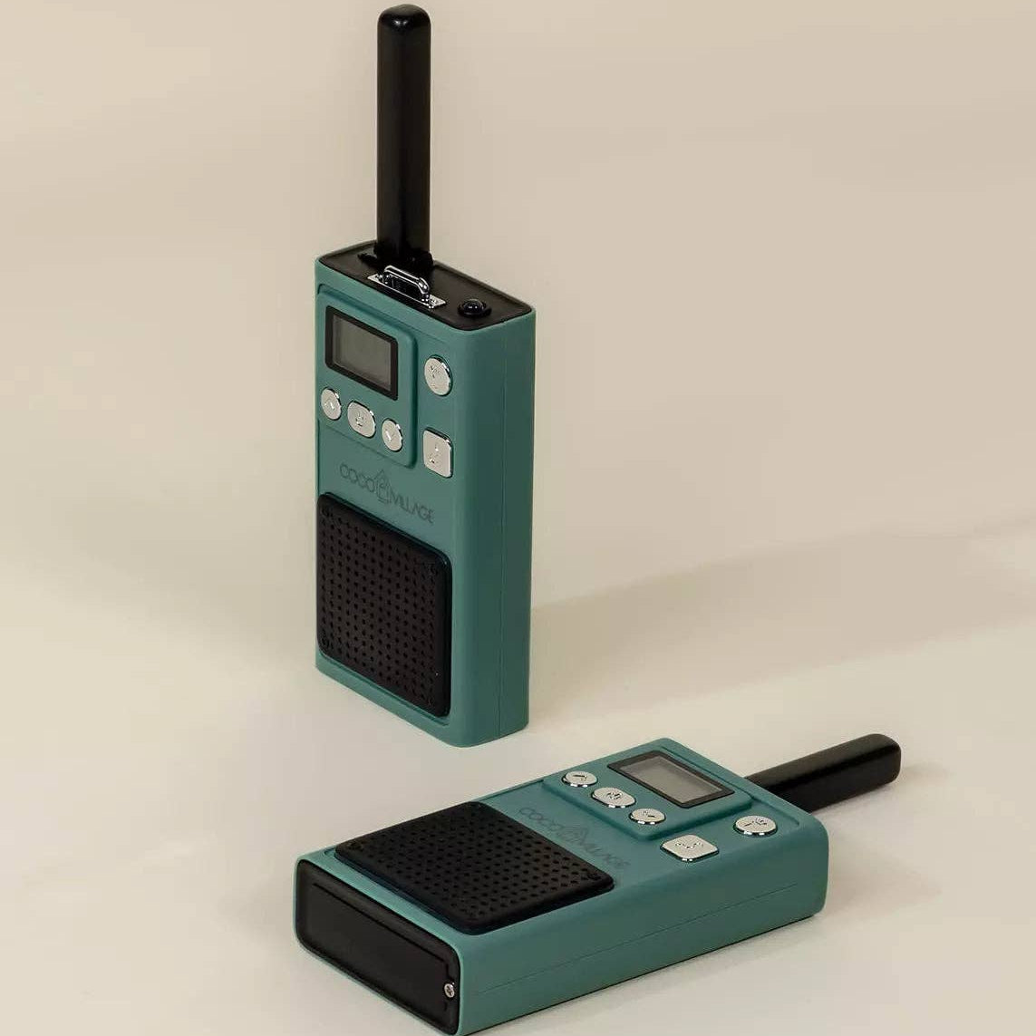 Two teal walkie-talkies on a beige background