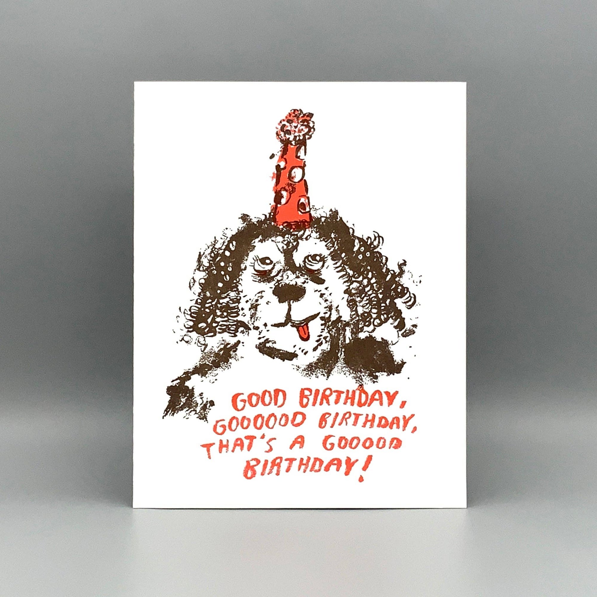 Birthday card with a dog wearing a party hat and celebratory text on a white background.
