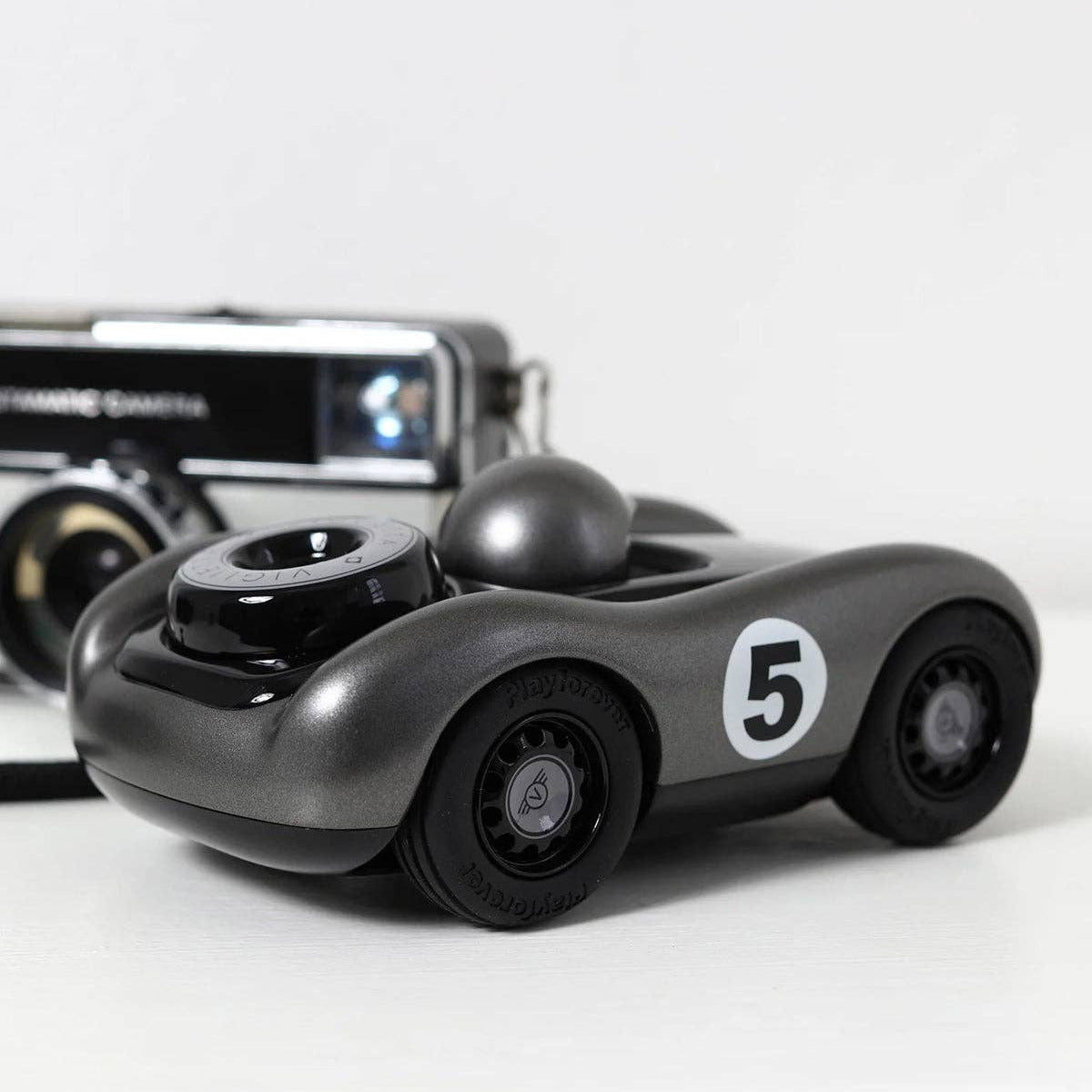 Toy car with number 5 on a white background