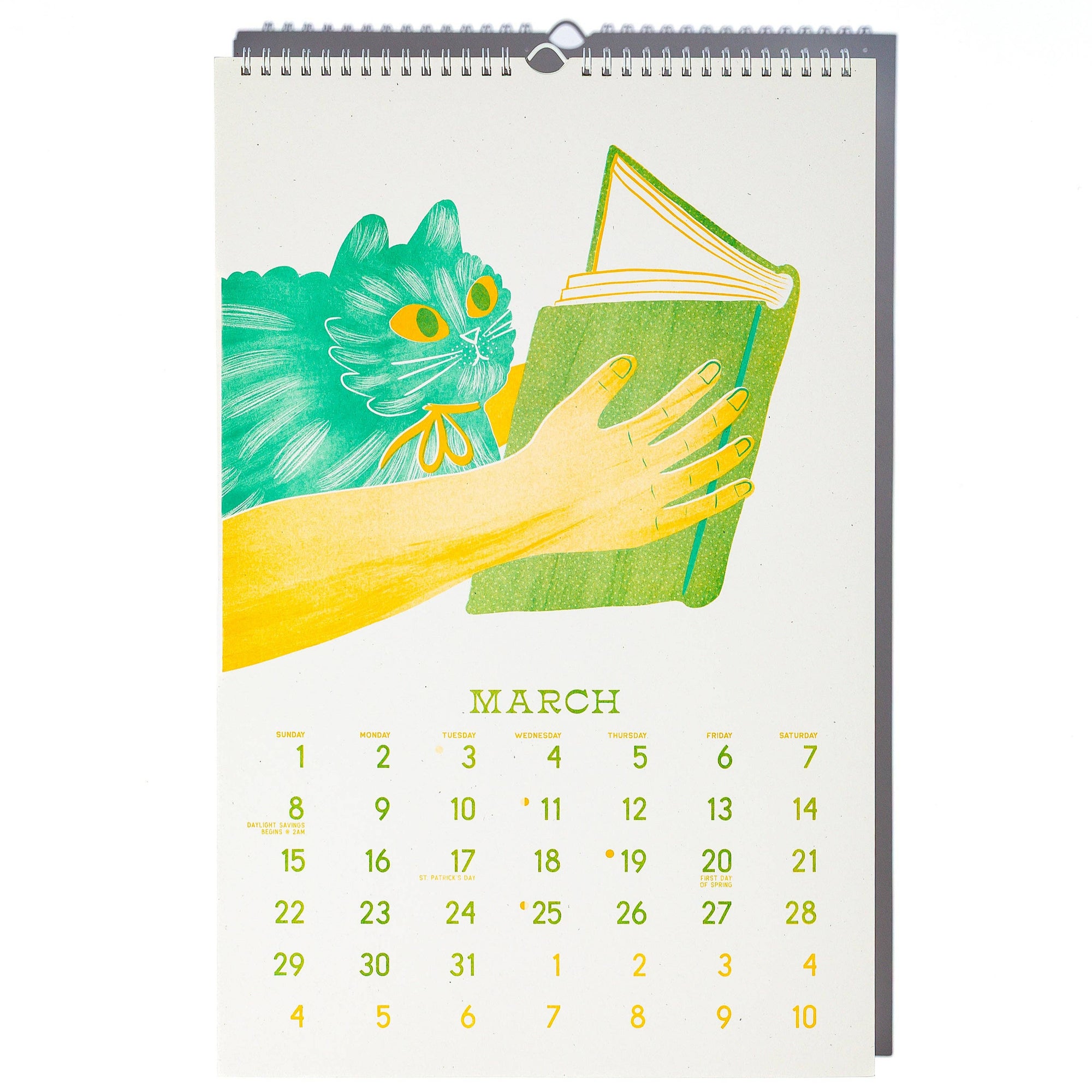 Calendar with illustration of a hand holding a green book and a green cat, on a white background