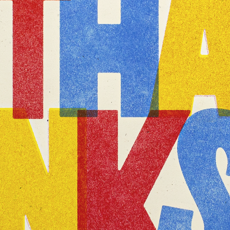 Abstract typographic artwork with large textured letters in red, blue, yellow, and off-white, partially forming the word "THANKS.".