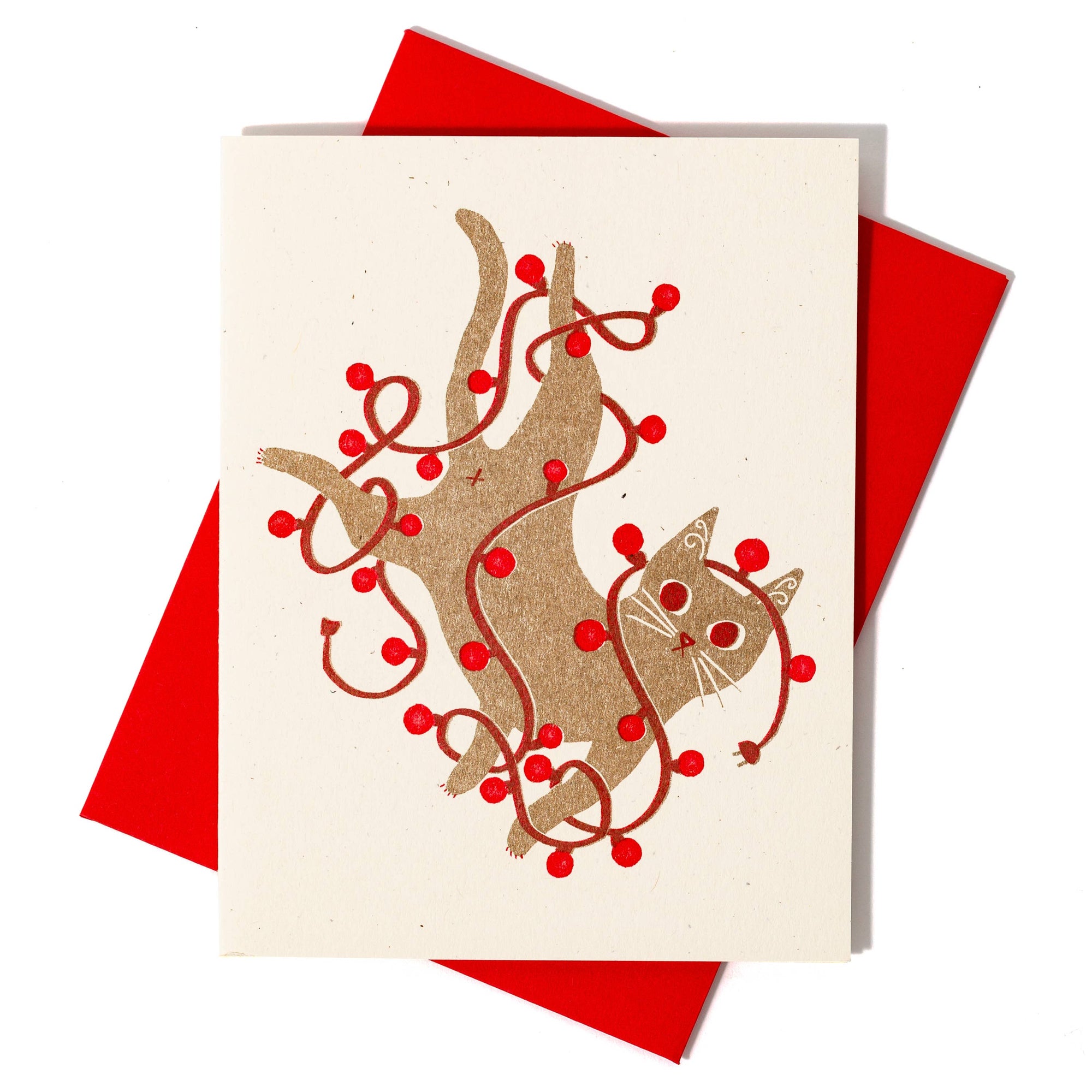 Greeting card with cat and branch design on a red envelope