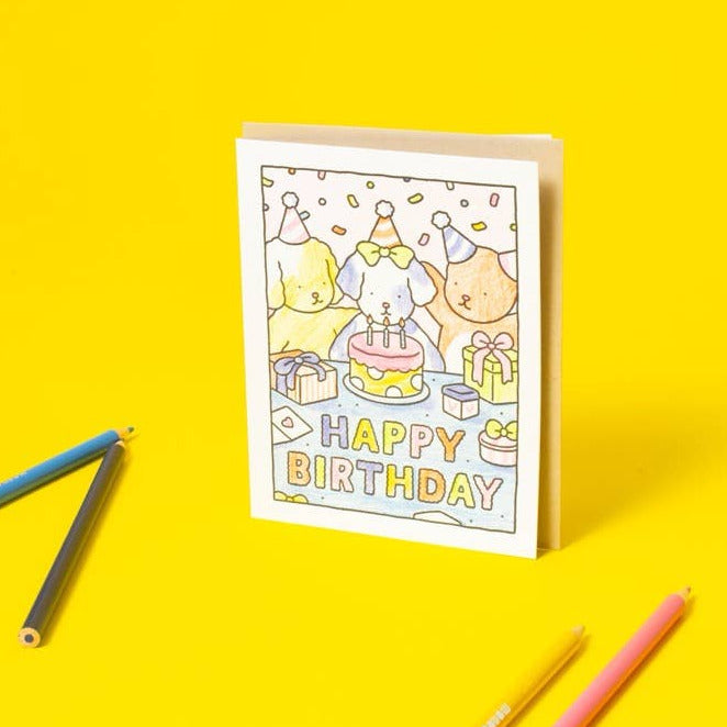 Birthday card with colorful pencils on a yellow background