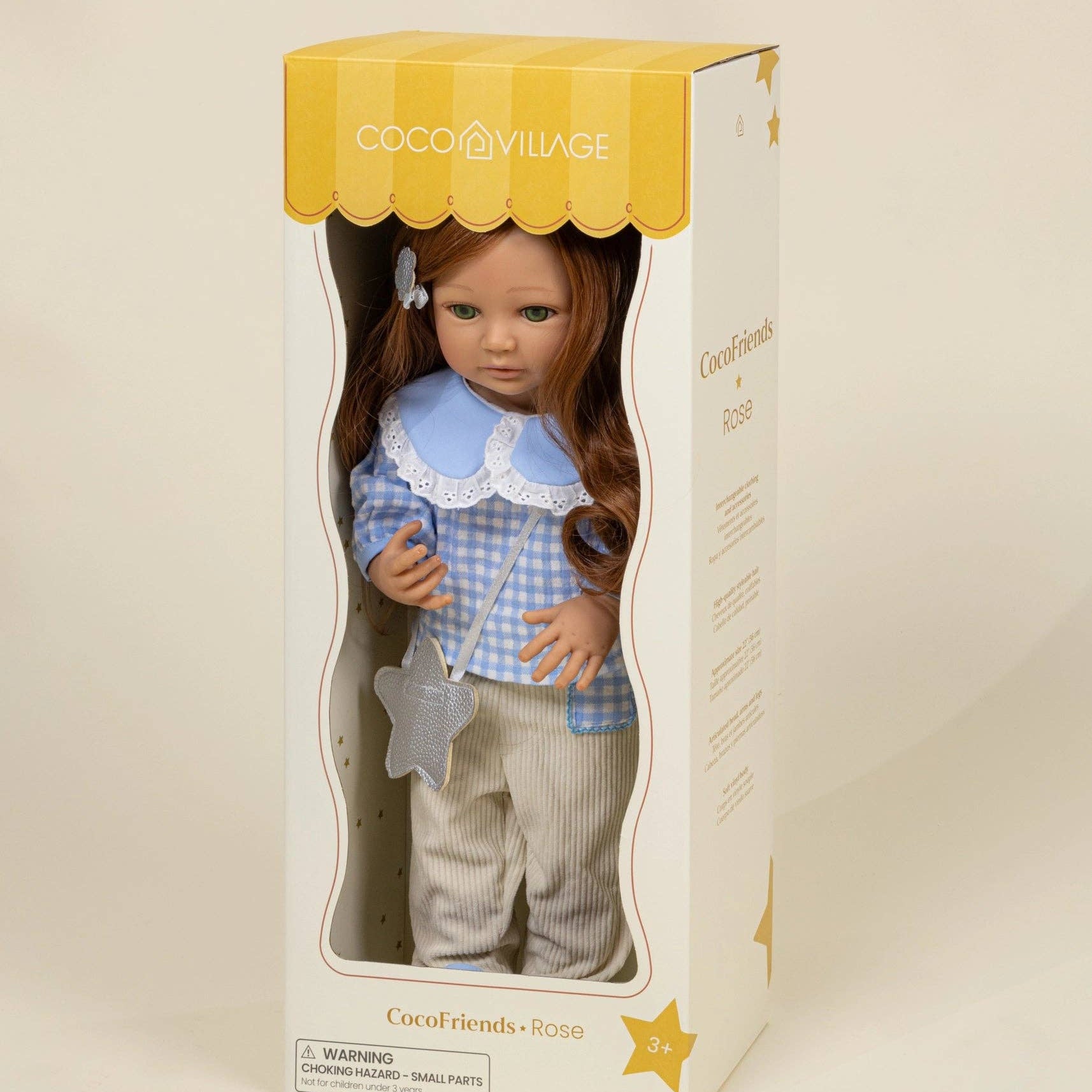 Doll in a box with a yellow and white striped lid, on a beige background