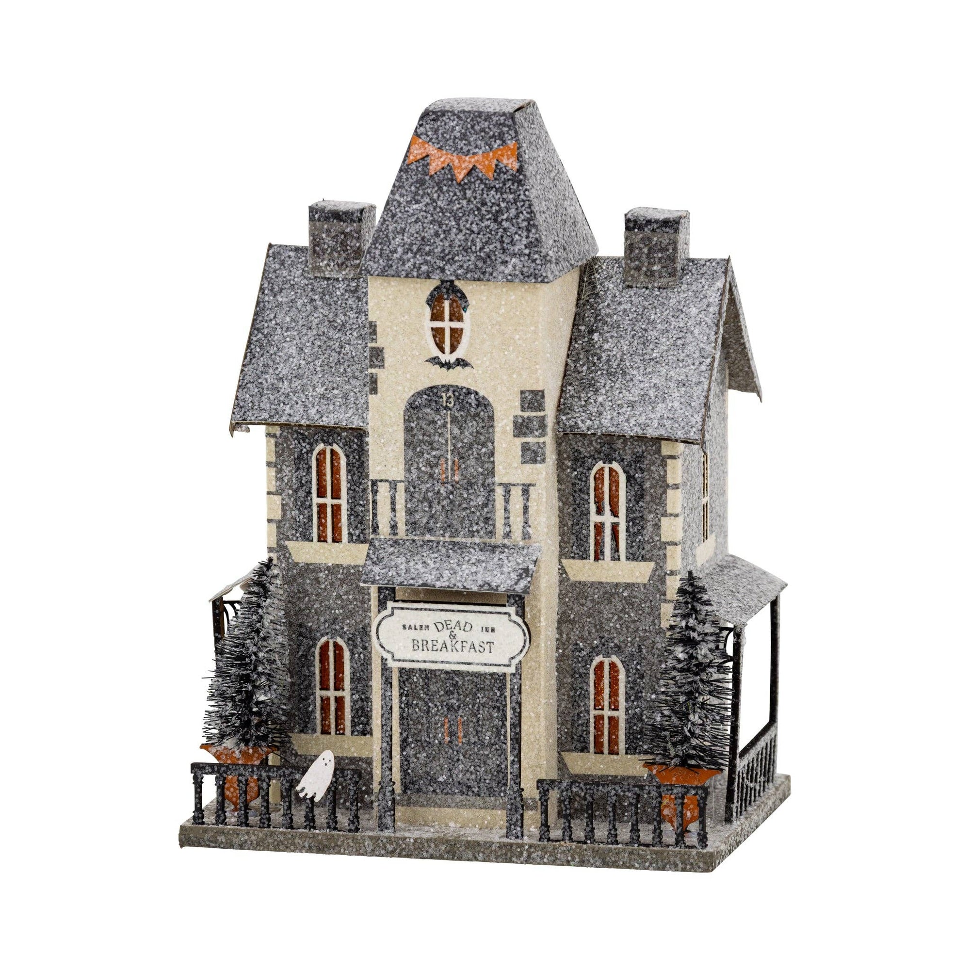 Halloween-themed miniature house with decorative elements on a white background