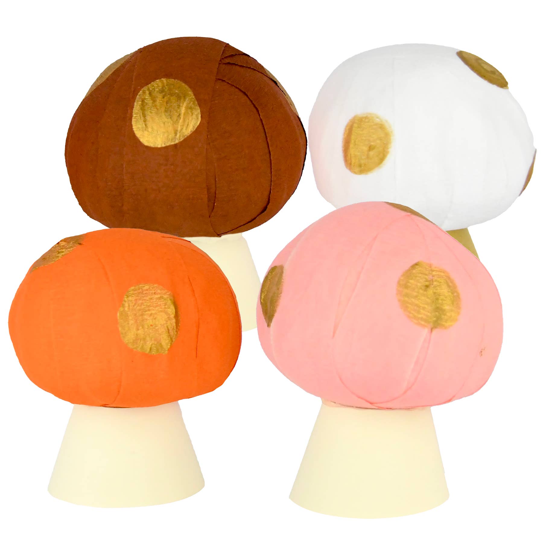 Four colorful mushroom-shaped surprise balls against a white background
