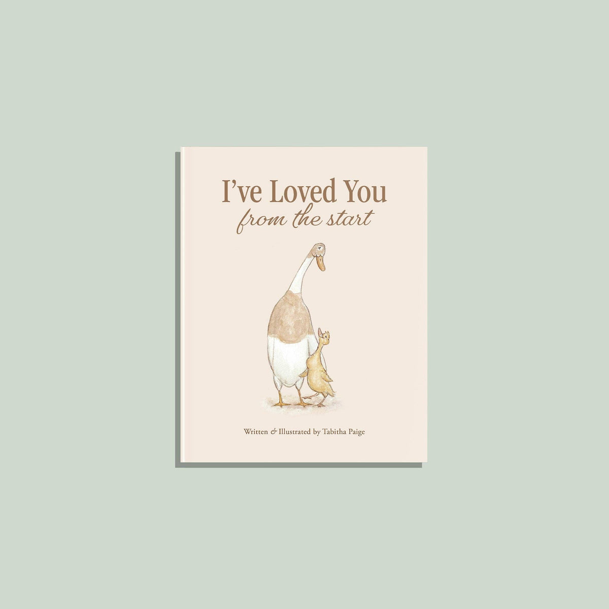 A book cover centered on a pale sage green background. The cover shows the title 'I've Loved You from the start' above an illustration of a goose and a duckling, with the text 'Written & Illustrated by Tabitha Page' at the bottom.