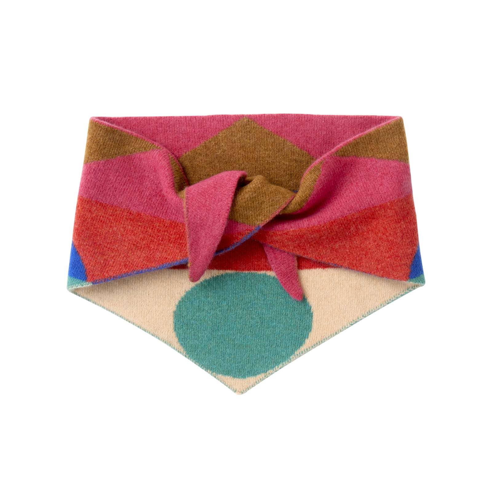 Colorful fabric bandana with geometric patterns on a white background