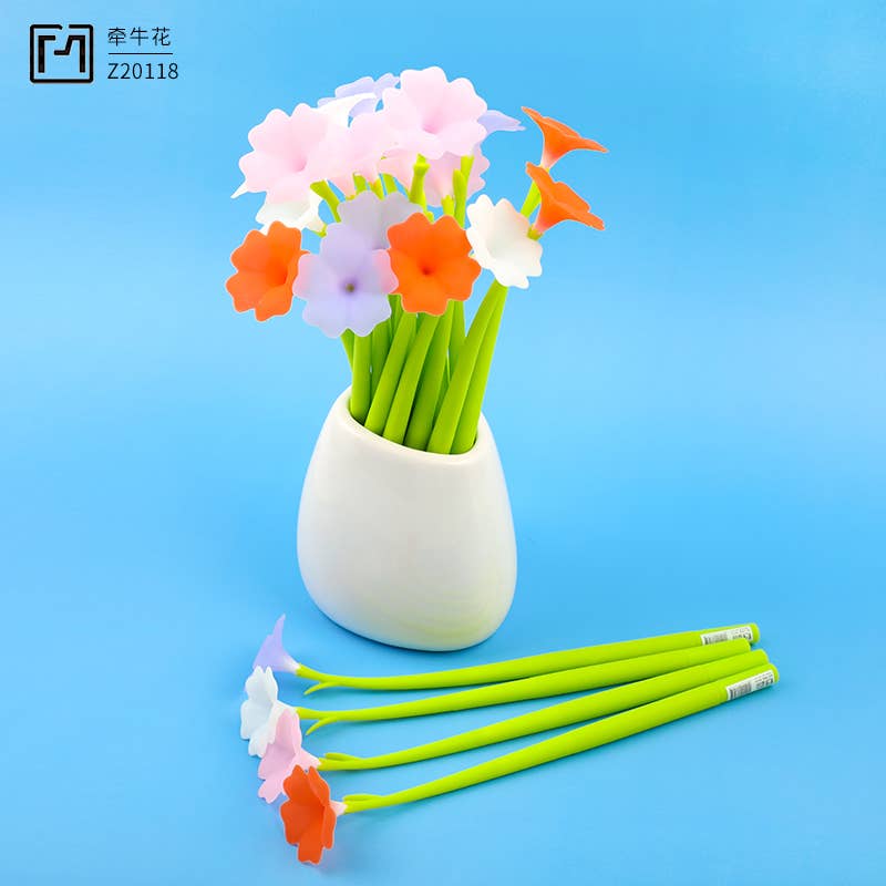 Colorful flower-shaped pens in a white vase on a blue background