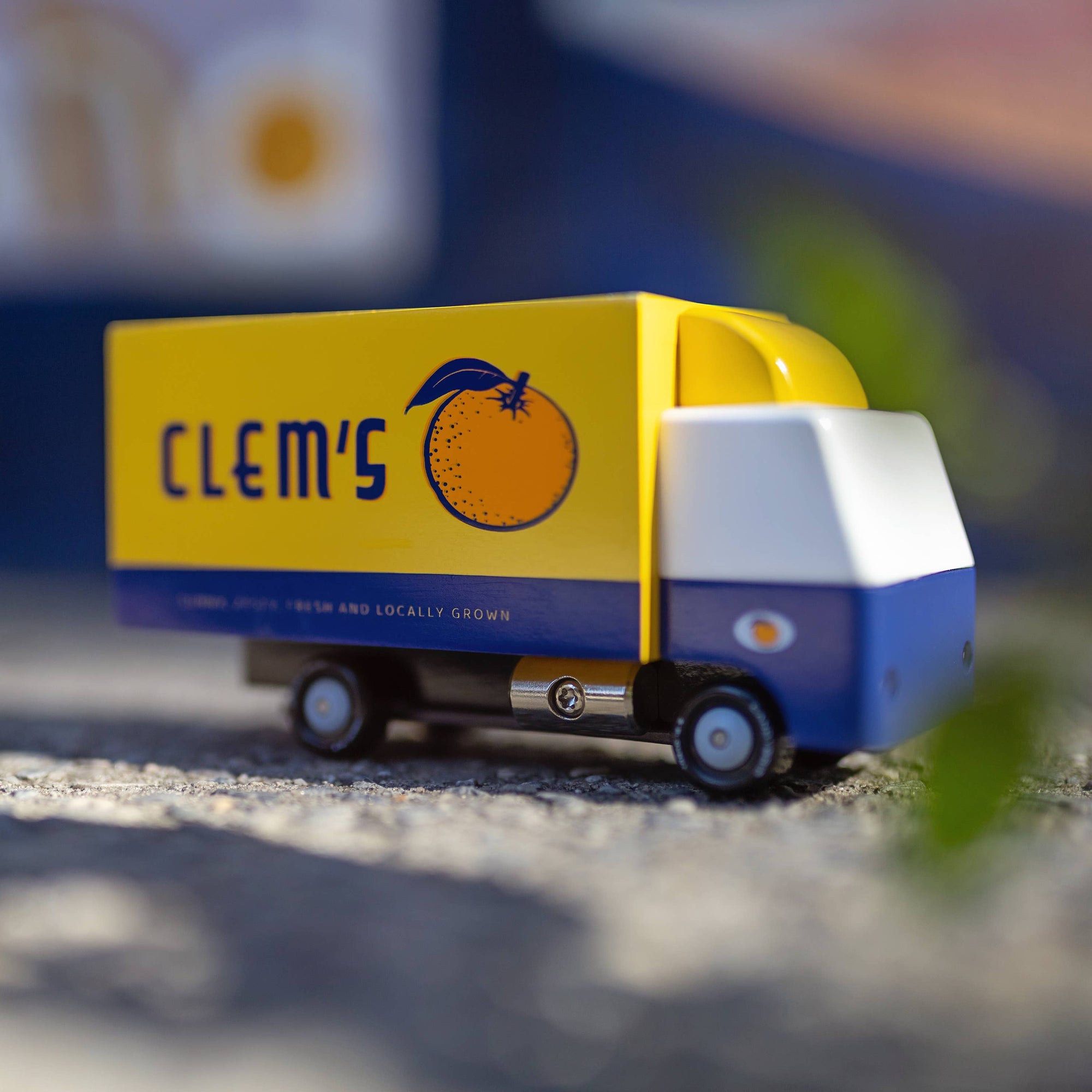 Model truck with 'Clem's' branding on a blurred background