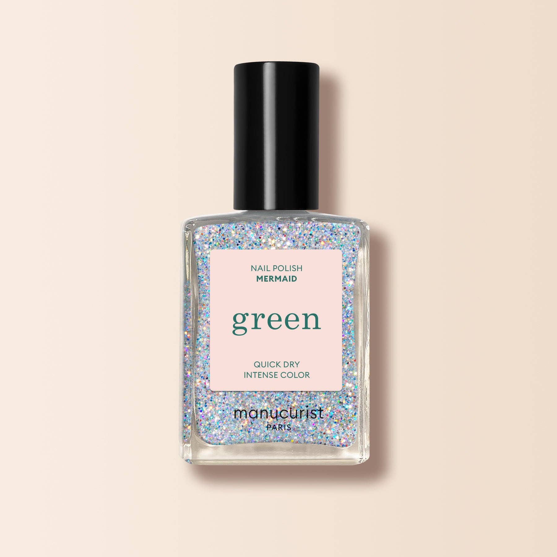 Nail polish bottle with glittery design and 'manucurist' branding on a beige background