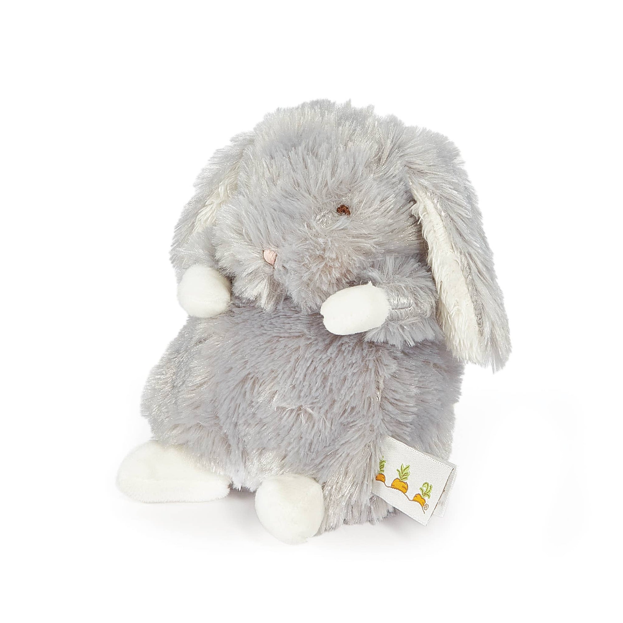 Gray plush bunny toy with white paws on a white background