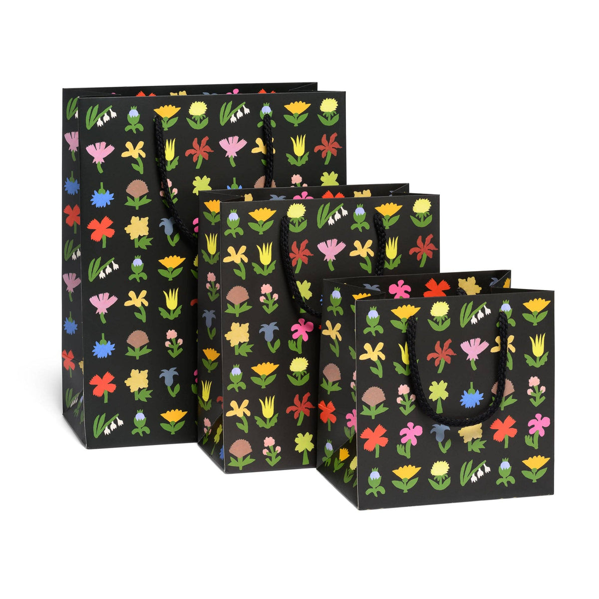 A set of black gift bags with colorful floral patterns, arranged in a staggered display on a clean white background.