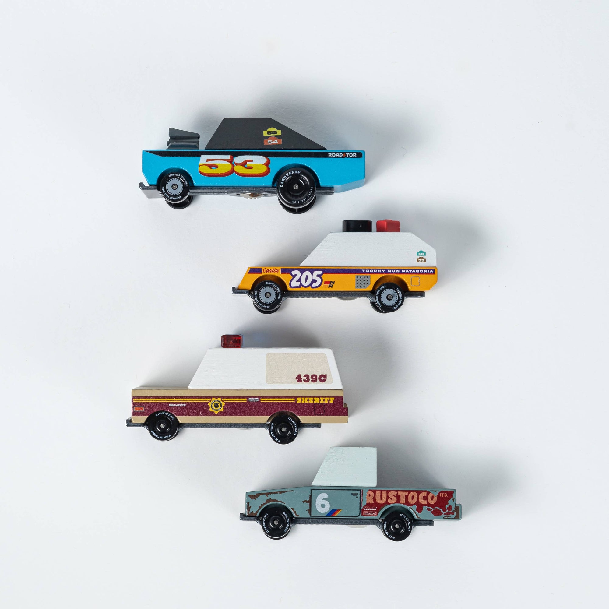 Set of four toy cars on a white background