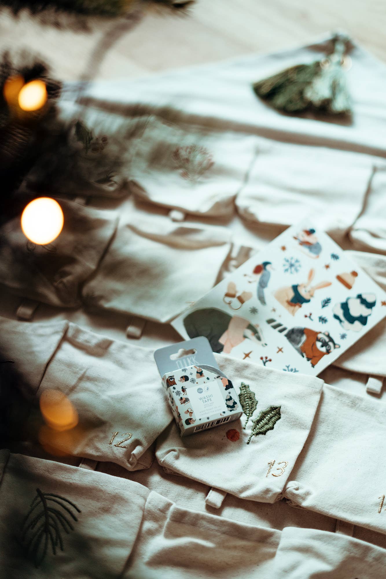 White shirt with decorative elements on a wooden surface with blurred lights in the background