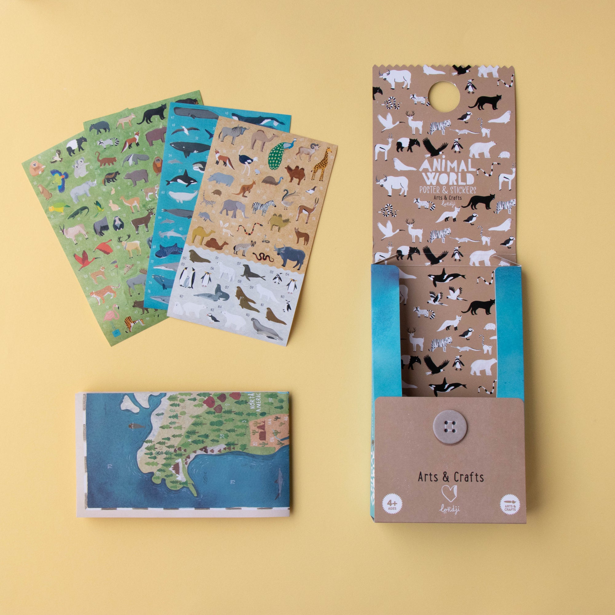 Set of stationery items with animal-themed designs on a yellow background