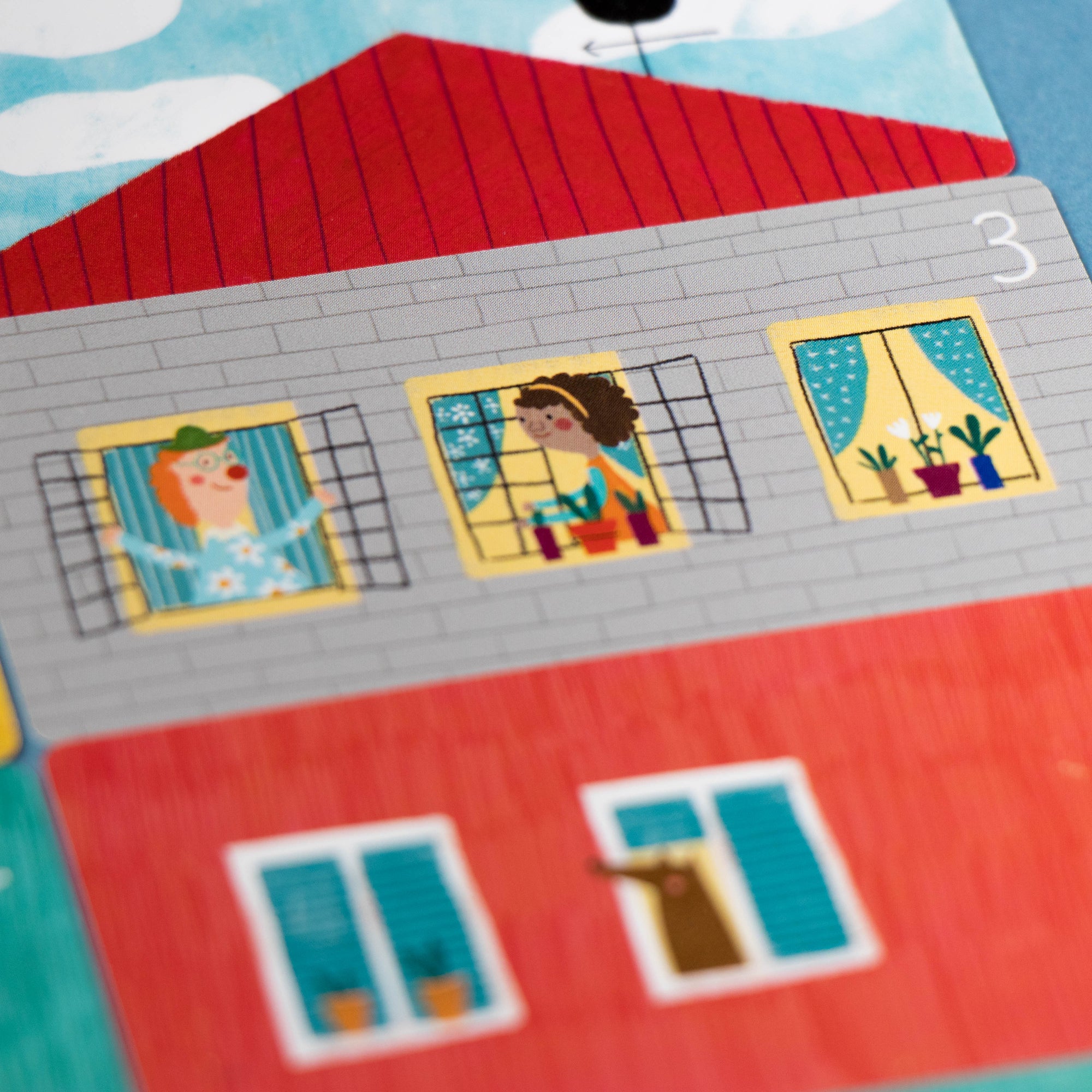 Children's educational puzzle with a house design on a blue background