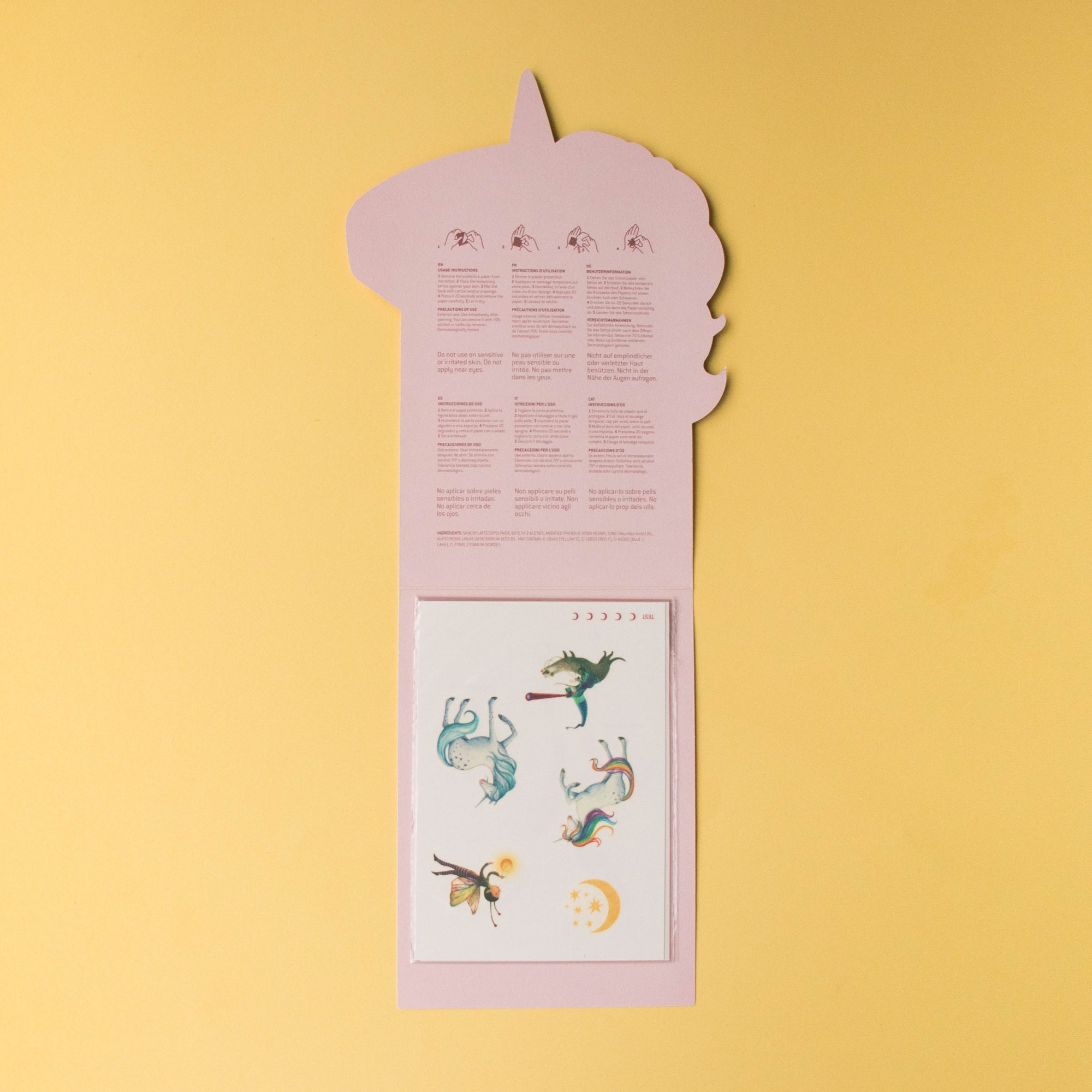 Decorative paper cutout with illustrations on a yellow background