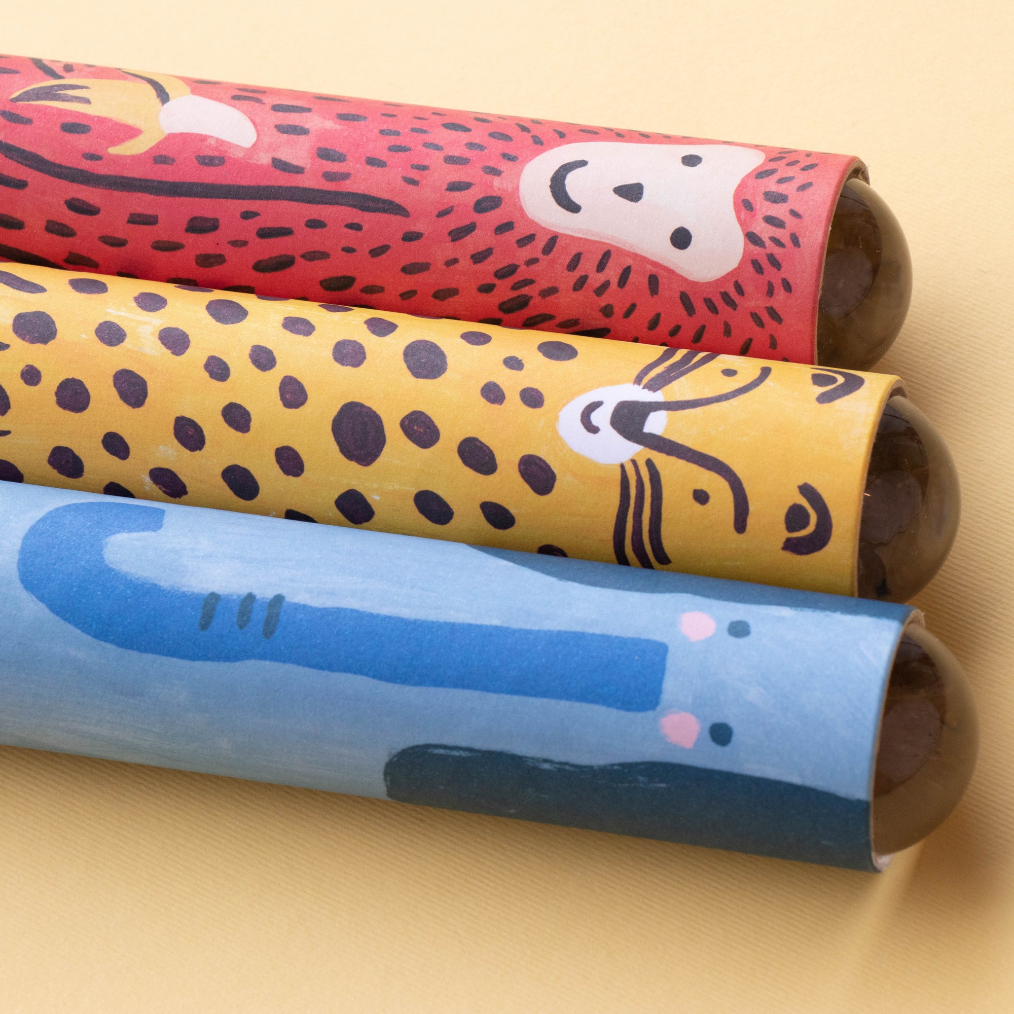 Three Kaleidoscopes with animal prints on a beige background