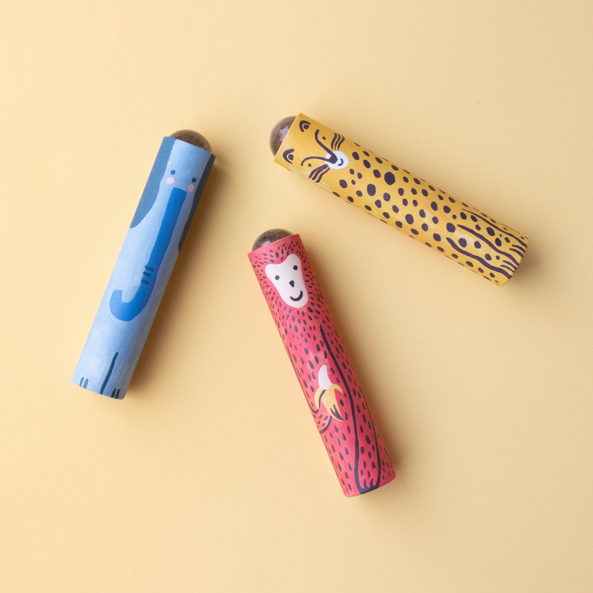 Three colorful Kaleidoscopes with animal prints on a beige background
