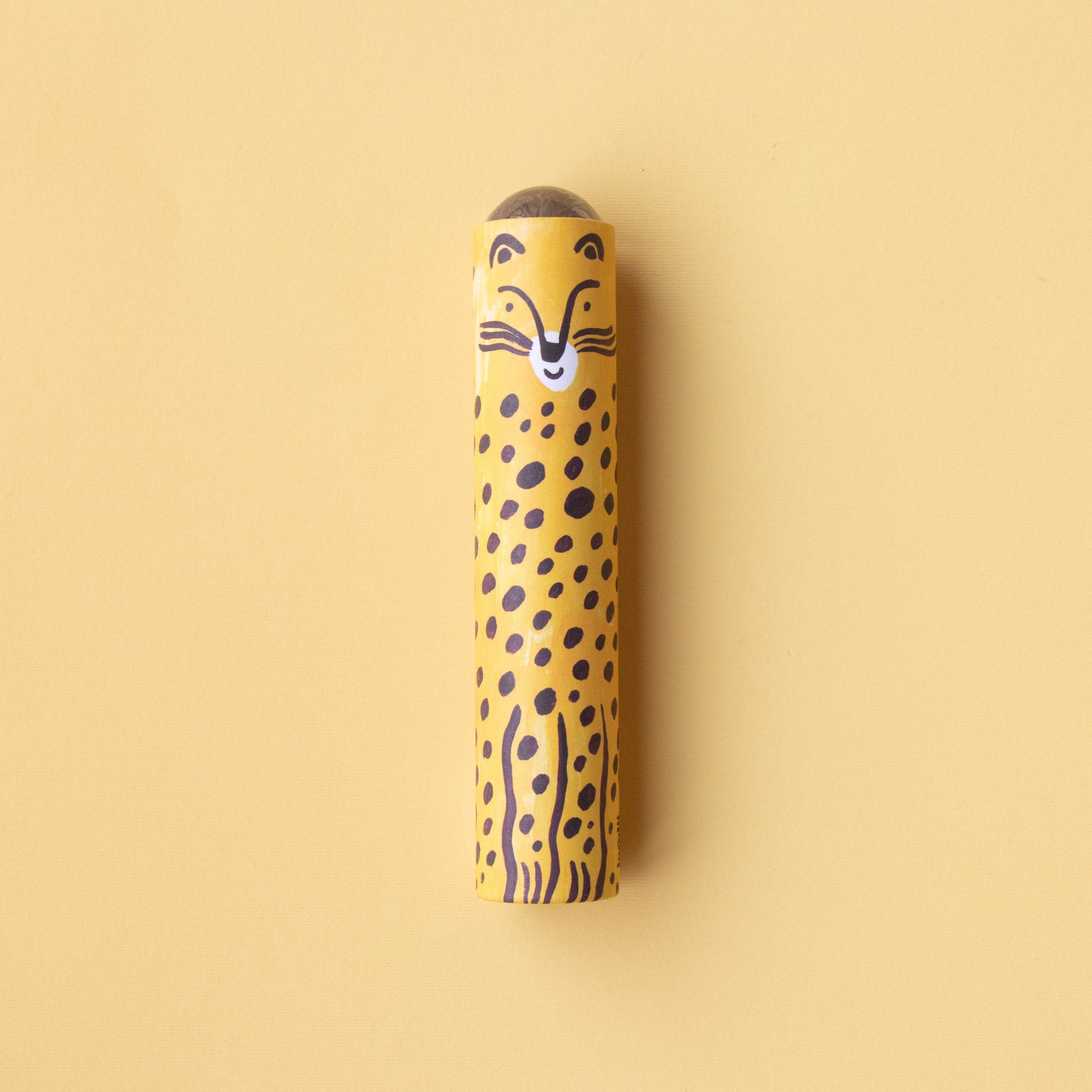 Kaleidoscope with a cheetah design on a beige background