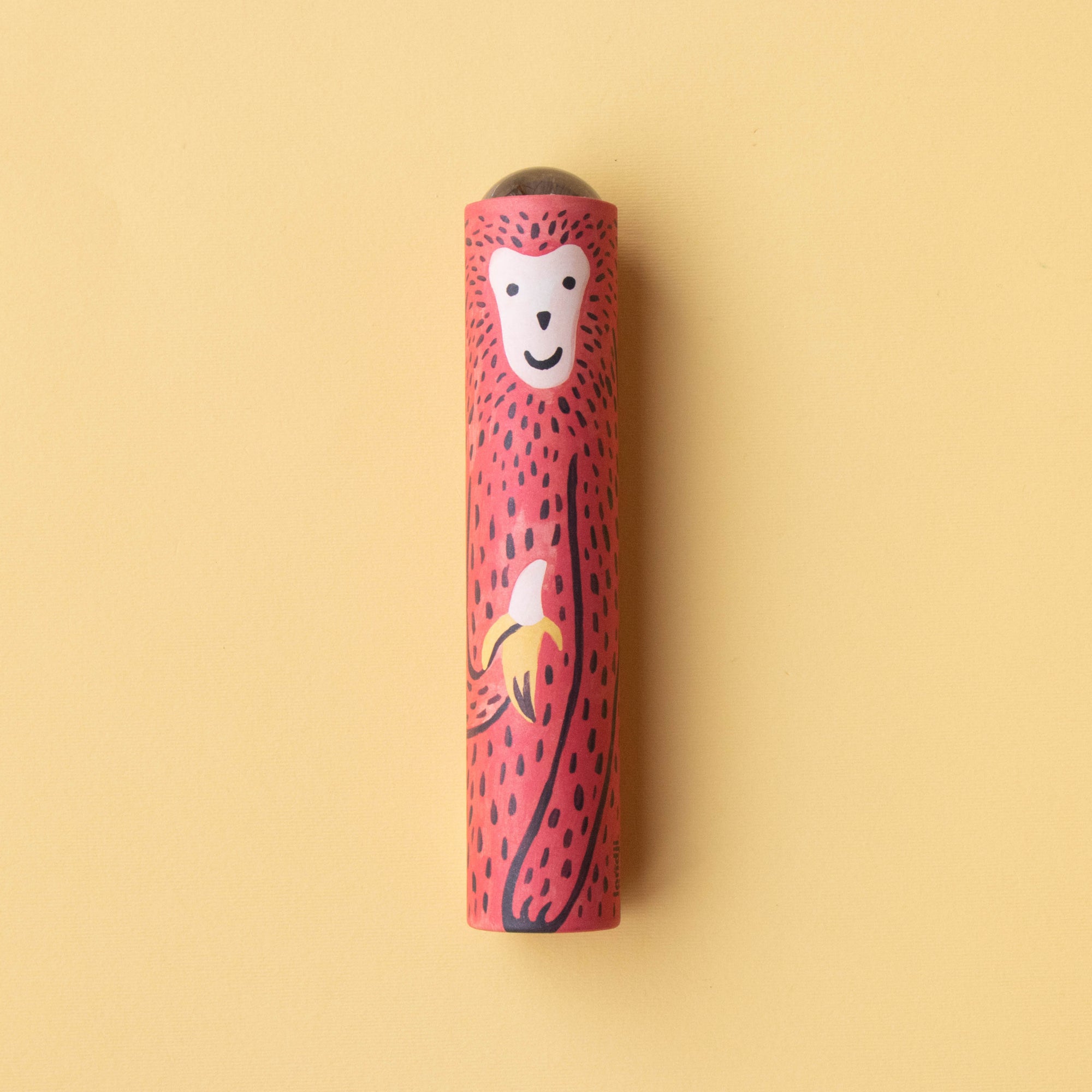 Red and black striped Kaleidoscope with a monkey design on a beige background