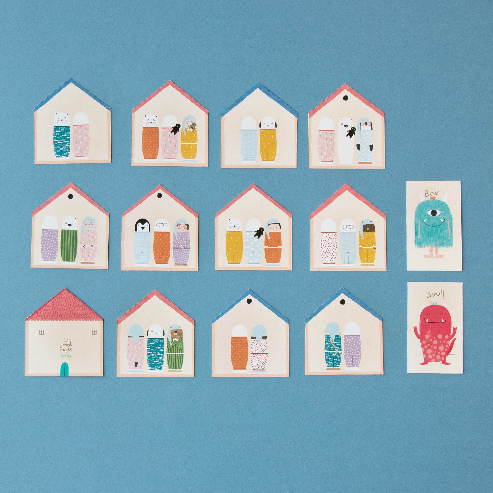 Row of small houses with colorful doors on a blue background