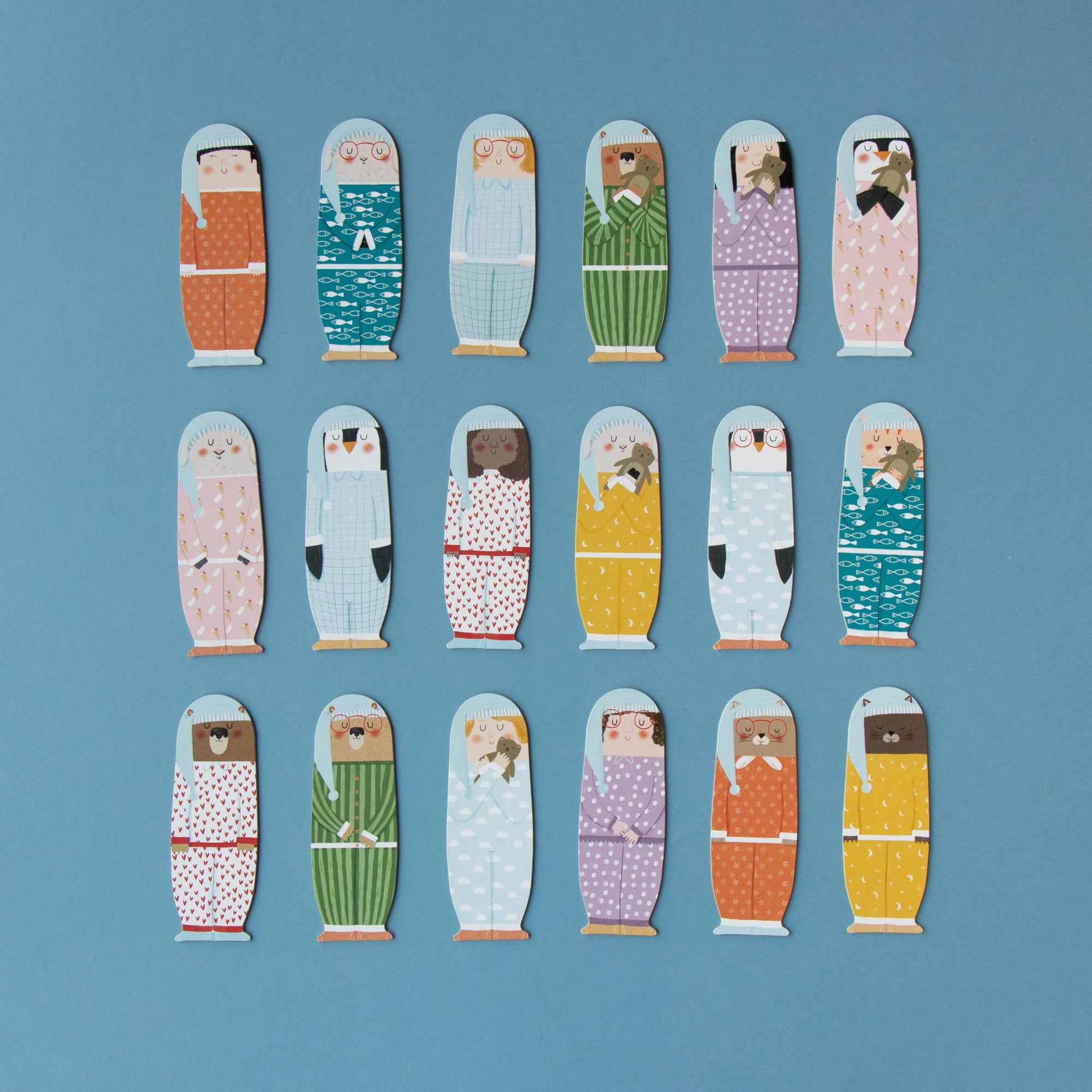 Set of colorful paper dolls on a blue background