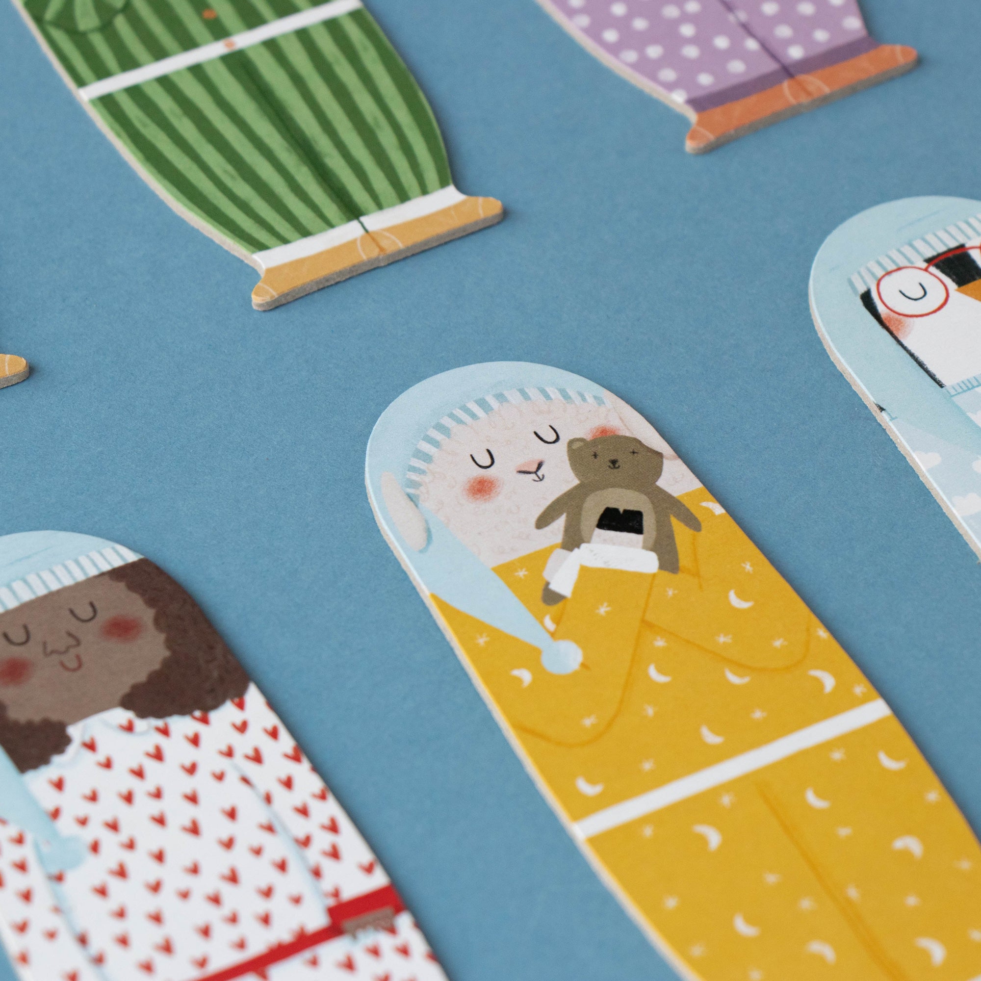 Illustrations of people in pajamas with a blue background