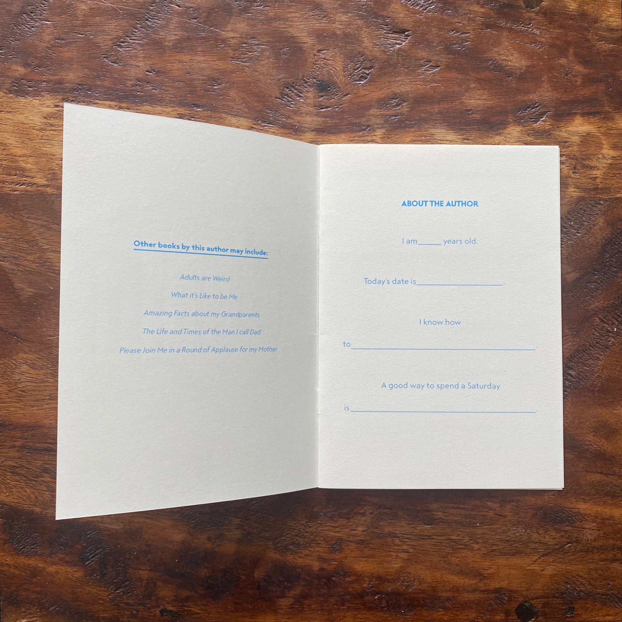 Open book with text on a wooden surface