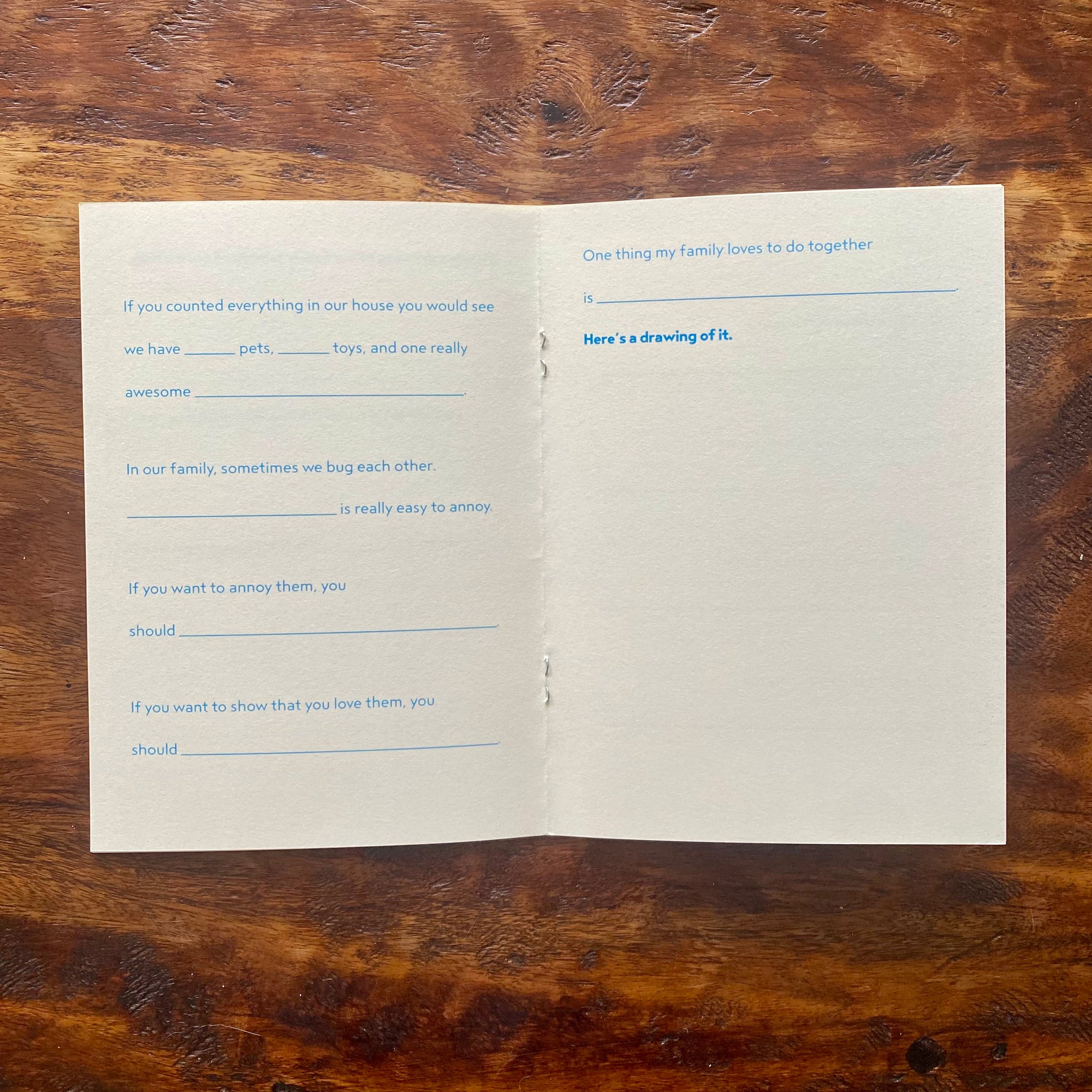 Open book with printed text on a wooden surface